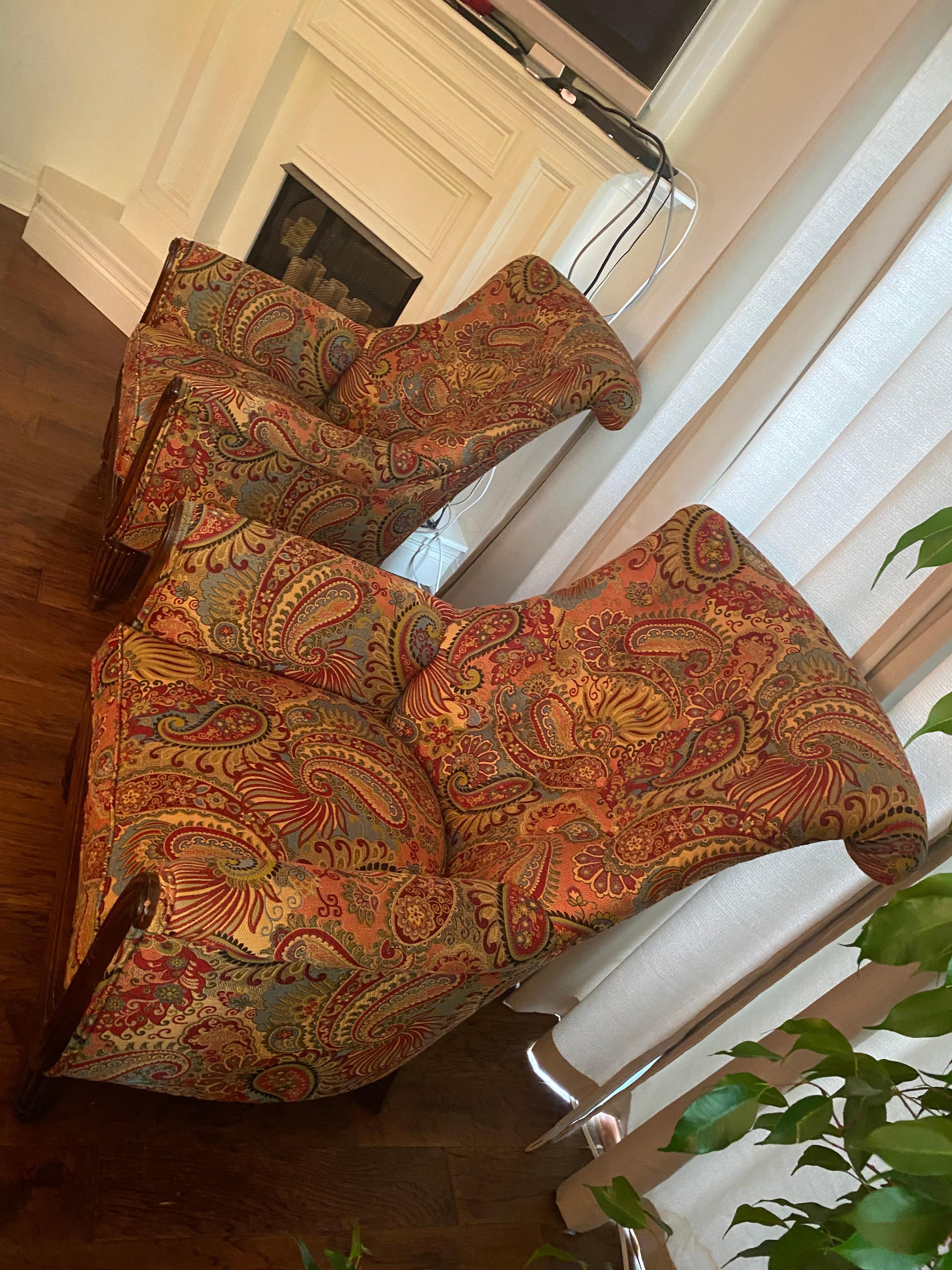 Richly upholstered paisley club chairs having tufted backs and curved carved wood armrests with reeded carved wood feet. The high backs are curved on the back side and great looking from every angle.
seat depth 21
Seat is a poly wrapped