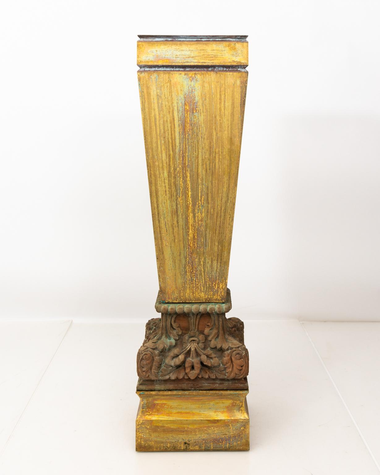 Pair of late 20th century large copper acid washed pedestals with wooden carved bases.
    