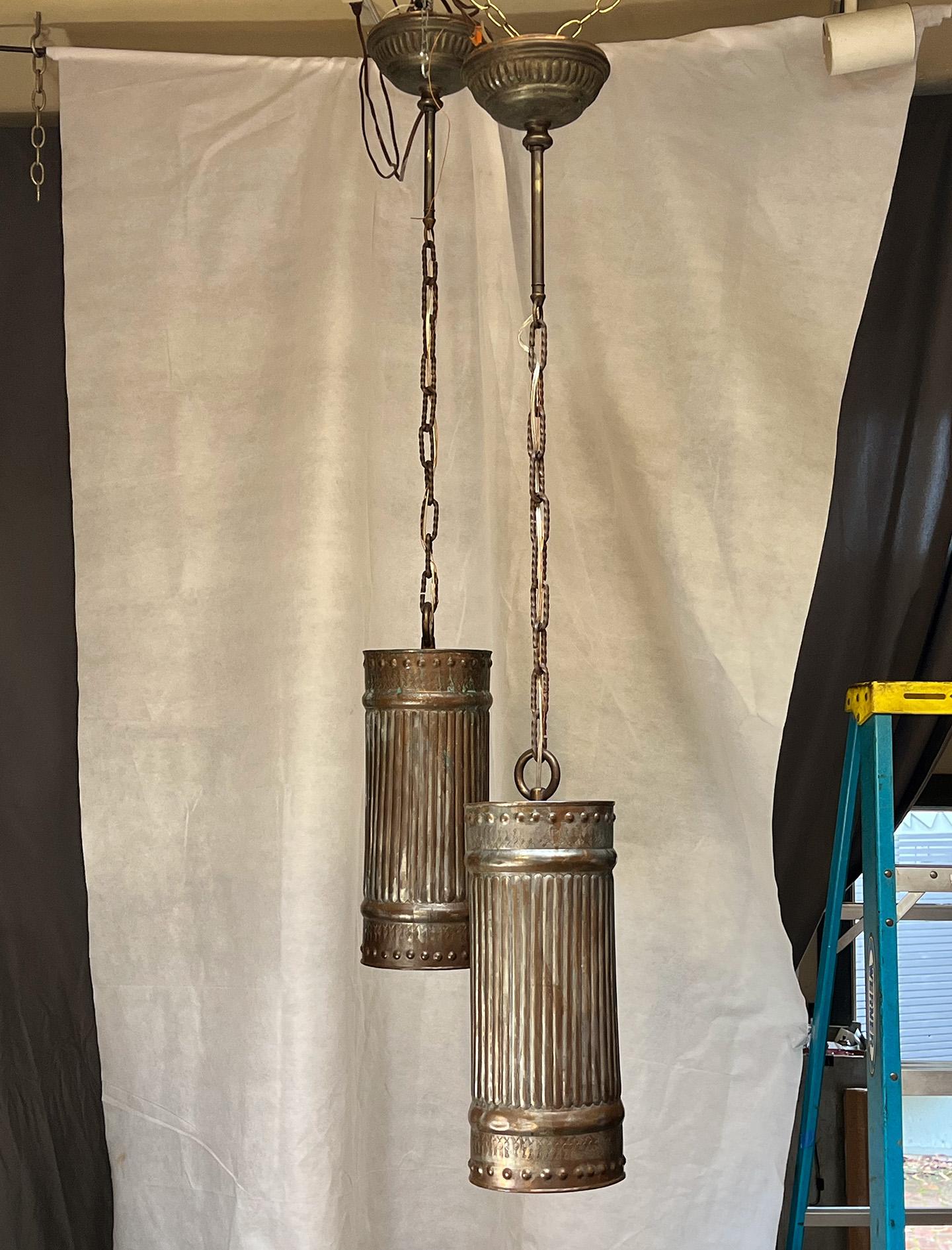 New things created from old things. This pair of lights started from a set of large copper drums, with matching lids, turn canopy. Chain is a found twisted steel 3' link run from Mexico. Together they make an outstanding pair of kitchen counter