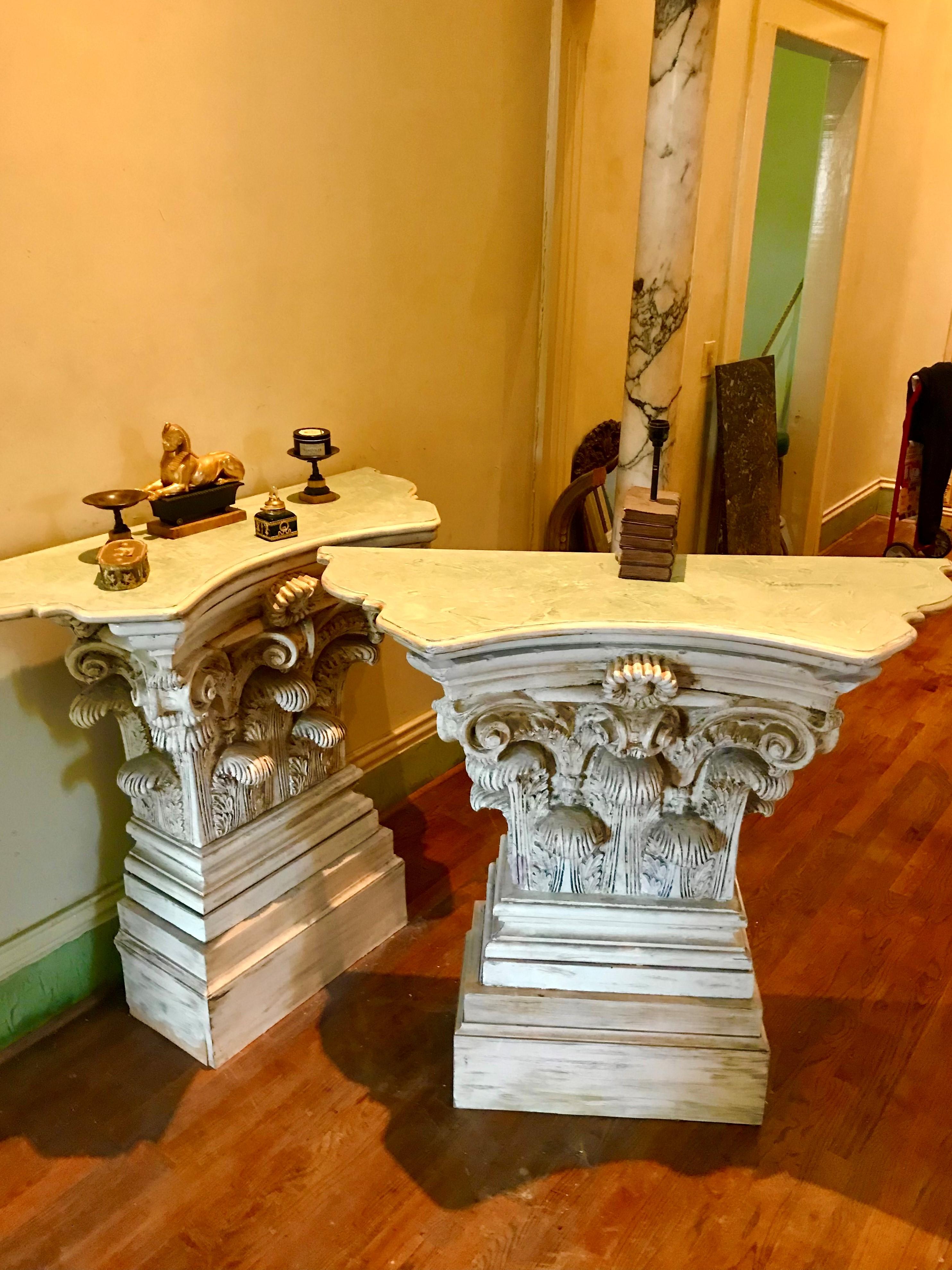 Pair of large consoles of Corinthian capital form, probably inspired by The Grand Tour souvenirs of the Roman Forum. Strong presence due to size and design but well formed, deeply cast and detail chased, Each with a faux marbleized top mint green