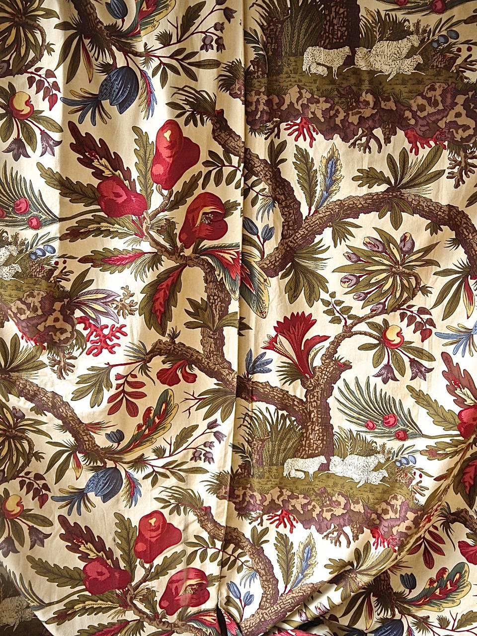 French antique very large pair of cotton curtains with a fabulous design of exotic flowers on meandering branches with a flock of sheep sheltering under a tree. Its original use was probably as hangings on a four-poster bed. Each curtain doubles