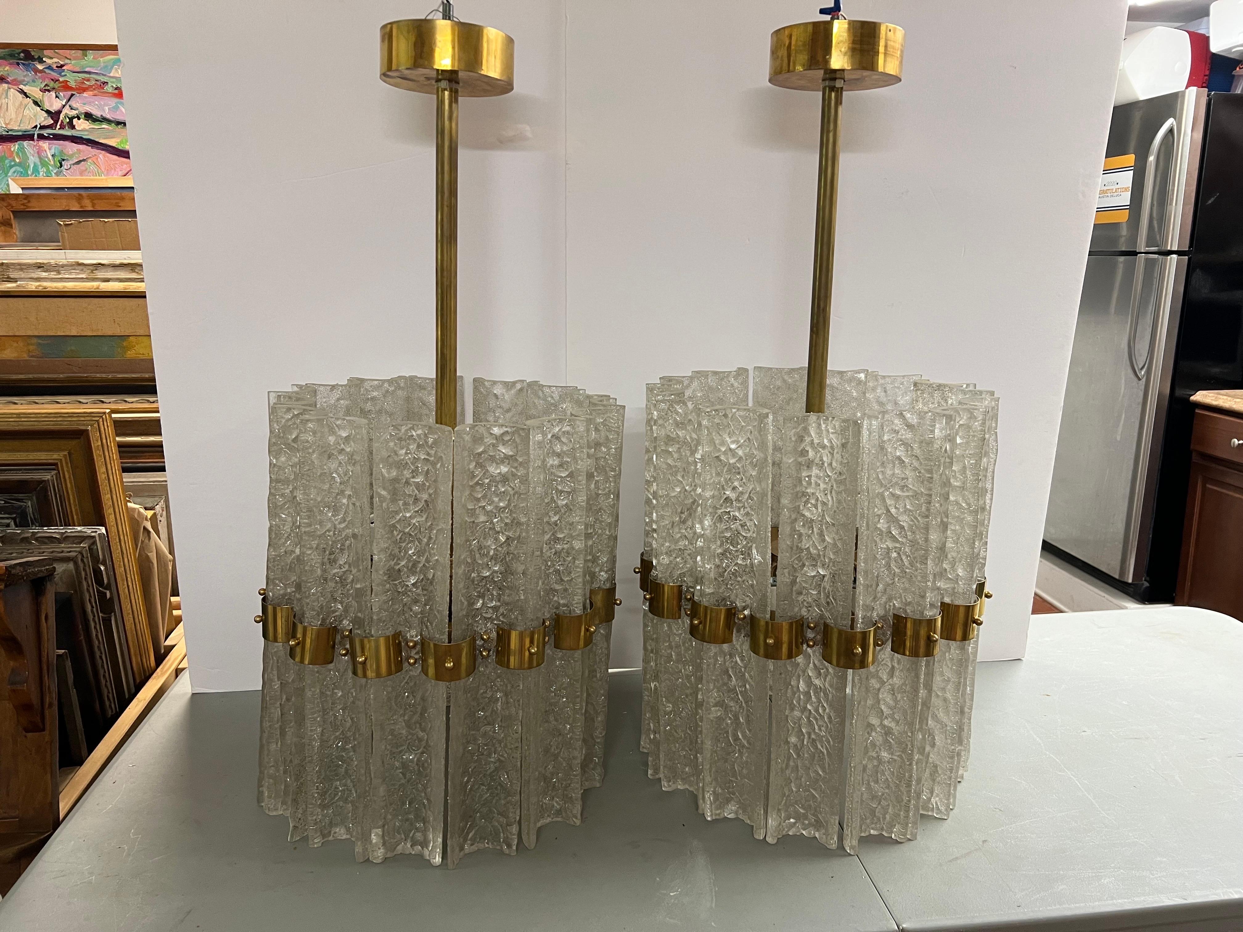 Pair of Large Crystal Orrefors Chandeliers by Carl Fagerlund. Perfect for above a dining table. They would be a dramatic statement in any home. We love the brass accents. They are mid century modern but clean in an minimalist way.
These pair are