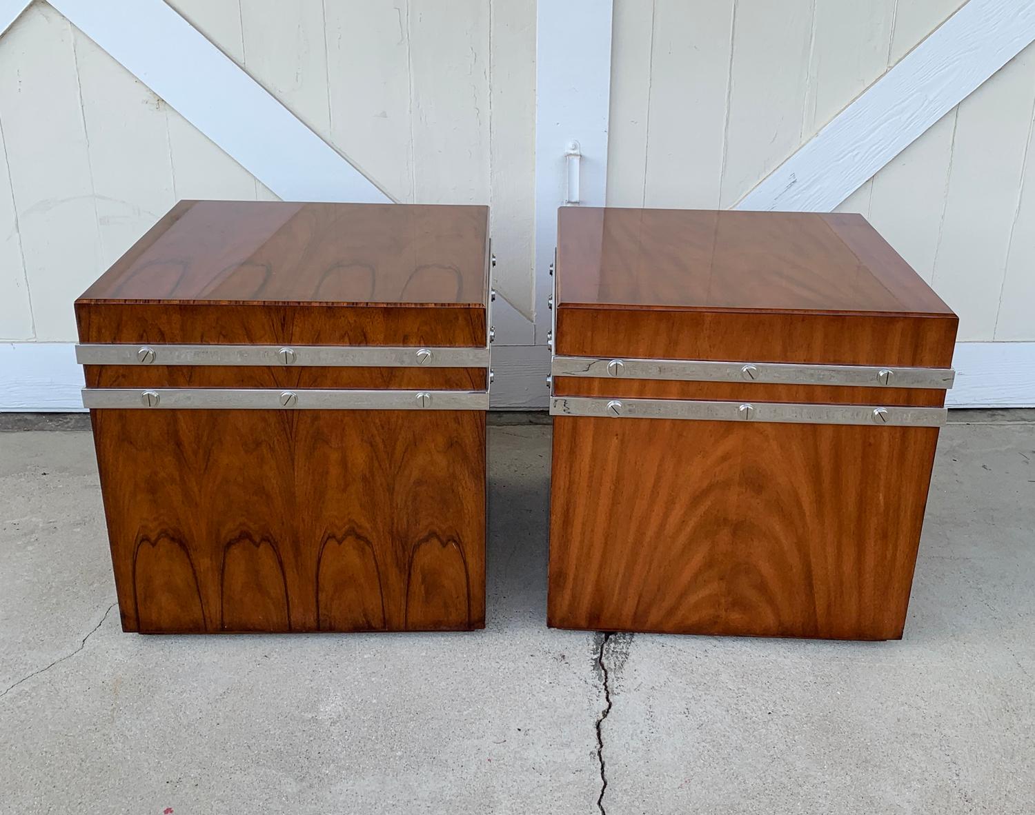 Nice pair of large cube tables/cabinets designed and manufactured by Theodore Alexander.
The cabinets are solidly built and with a chrome metal binding all around.
The pieces retain the original label.

The cabinets are in original condition and