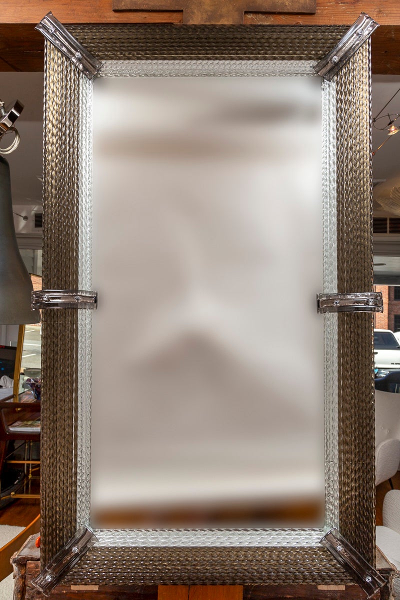 Pair of rectangular shaped mirrors composed of taupe and clear blown twisting rods each faceted with six greige glass rectangular fittings.  Mirrors may be hung horizontally or vertically.

Origin: Handmade in Murano Italy  

Dating: