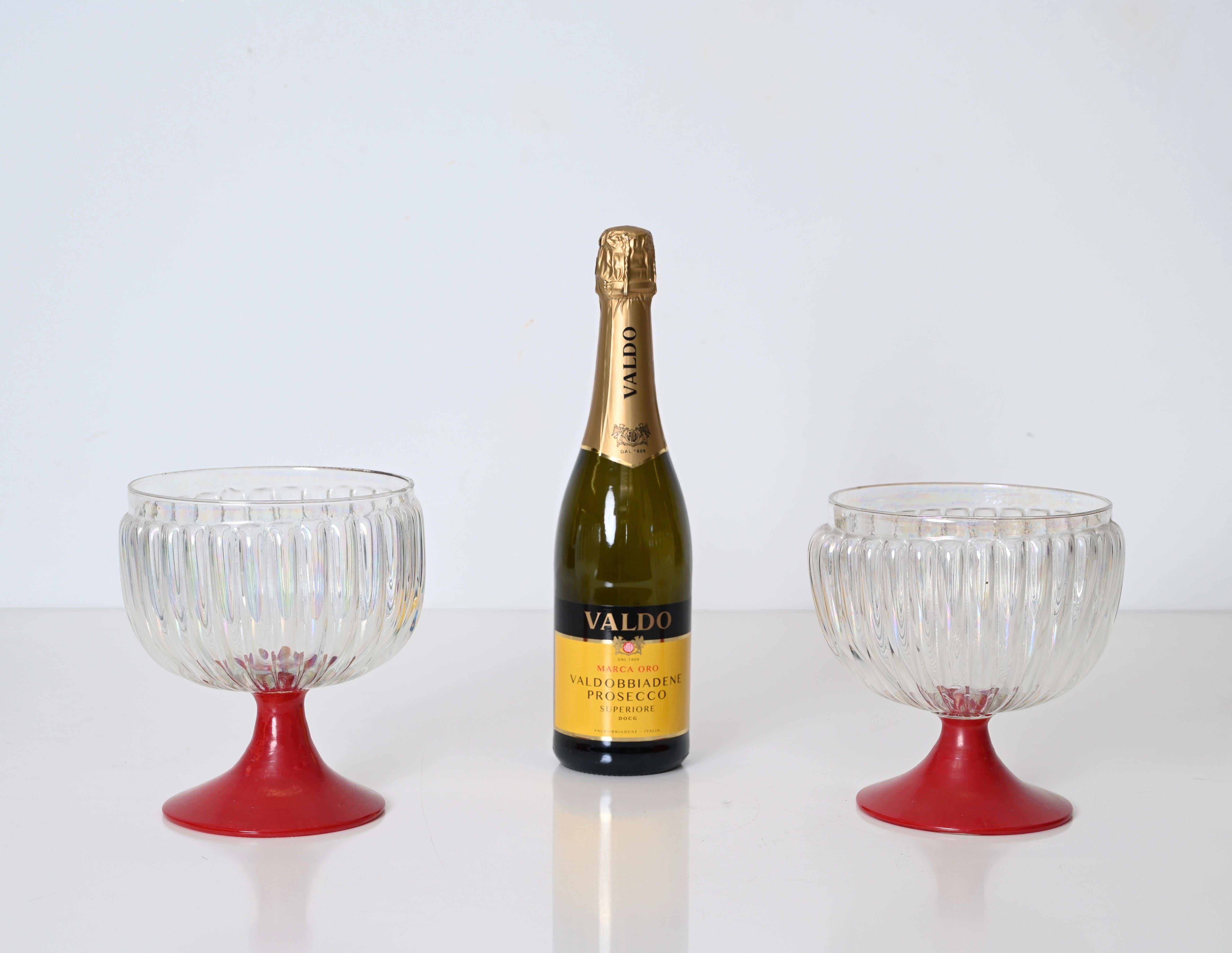 Amazing pair of large decorative Murano glasses. These stunning glasses were hand-made in Italy, Murano in the 1940s. 

The quality of these decorative goblet glasses is incredible, the base is made in a deep red glass with the cup made in a