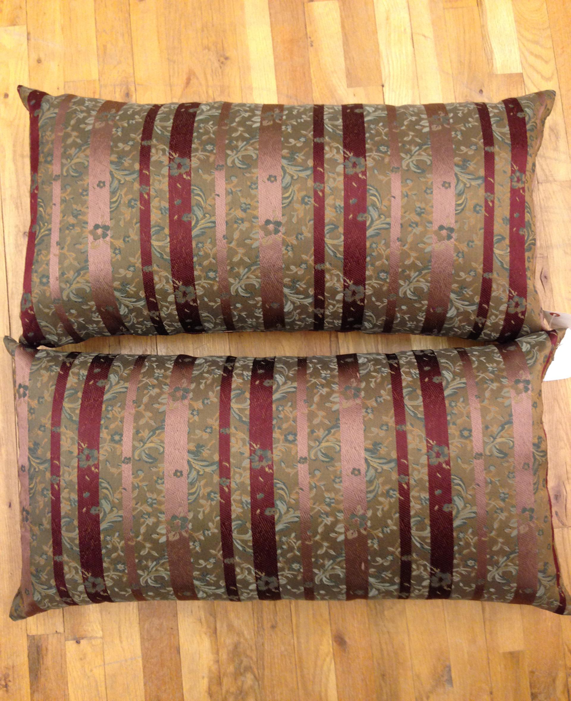 A pair of large decorative satin pillows, covered on both sides with a vintage striped brocade, size 18 inch x 34 inch each. This pair of oversize pillows are a great choice to add oomph, color and texture to your decor. The exterior features a