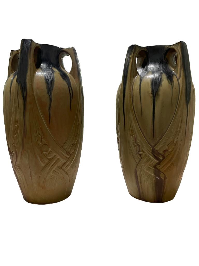 Pair of Large French Art Nouveau ceramic vase, Denbac (1909-1952) produced in Vierzon. Collector's item with a unique art nouveau handle organic form. 
Manufacture de Gres Flammes, approx. 1910/11, ceramic, four handles ending in bands over thebody,