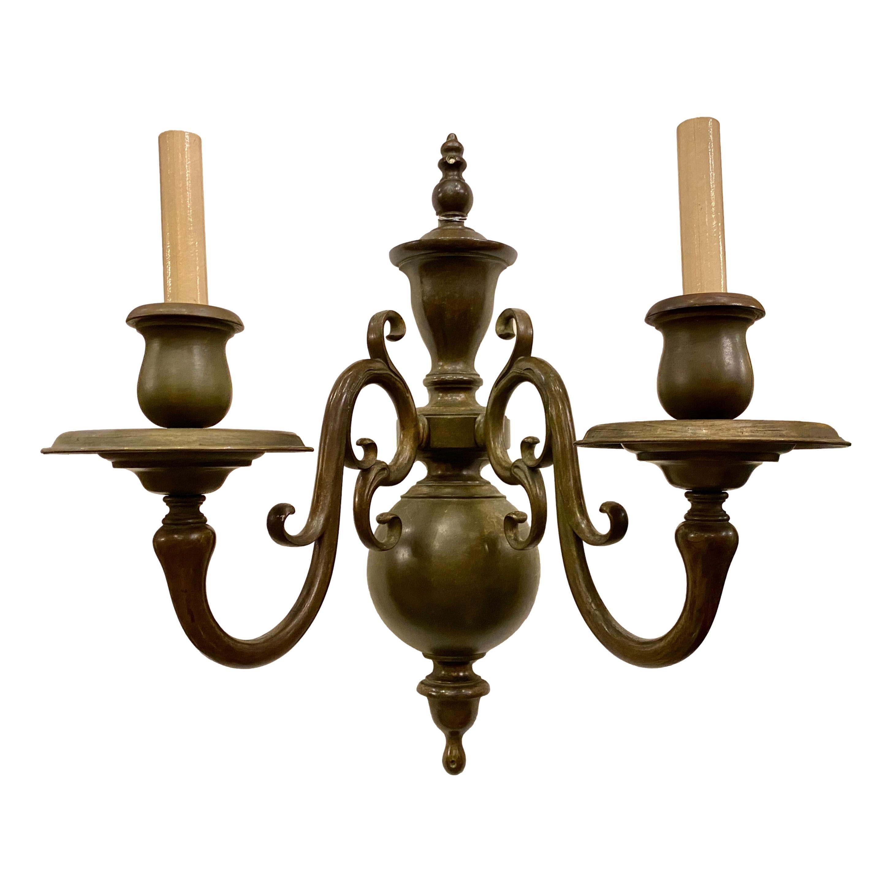 Pair of circa 1900 Dutch two-arm lights sconces in a patinated bronze finish.

Measurements:
Height: 20.5