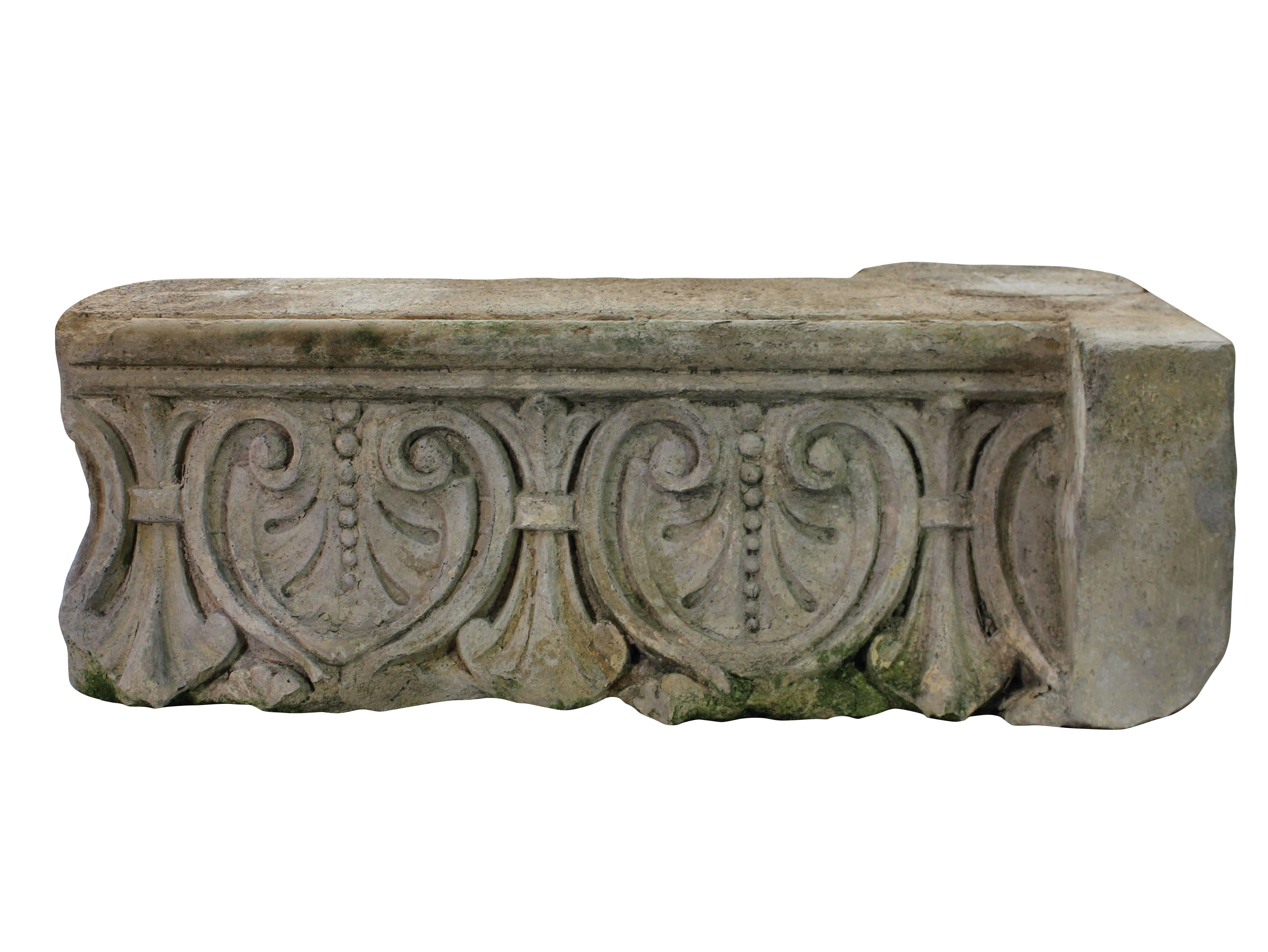 A pair of large English classically carved limestone architectural fragments depicting acanthus with traces of paint.
  