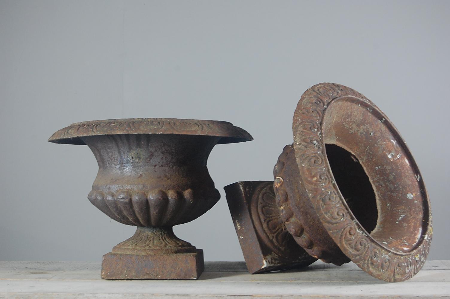 Pair of large, weathered early 20th century garden urns, in cast iron. France, circa 1920.