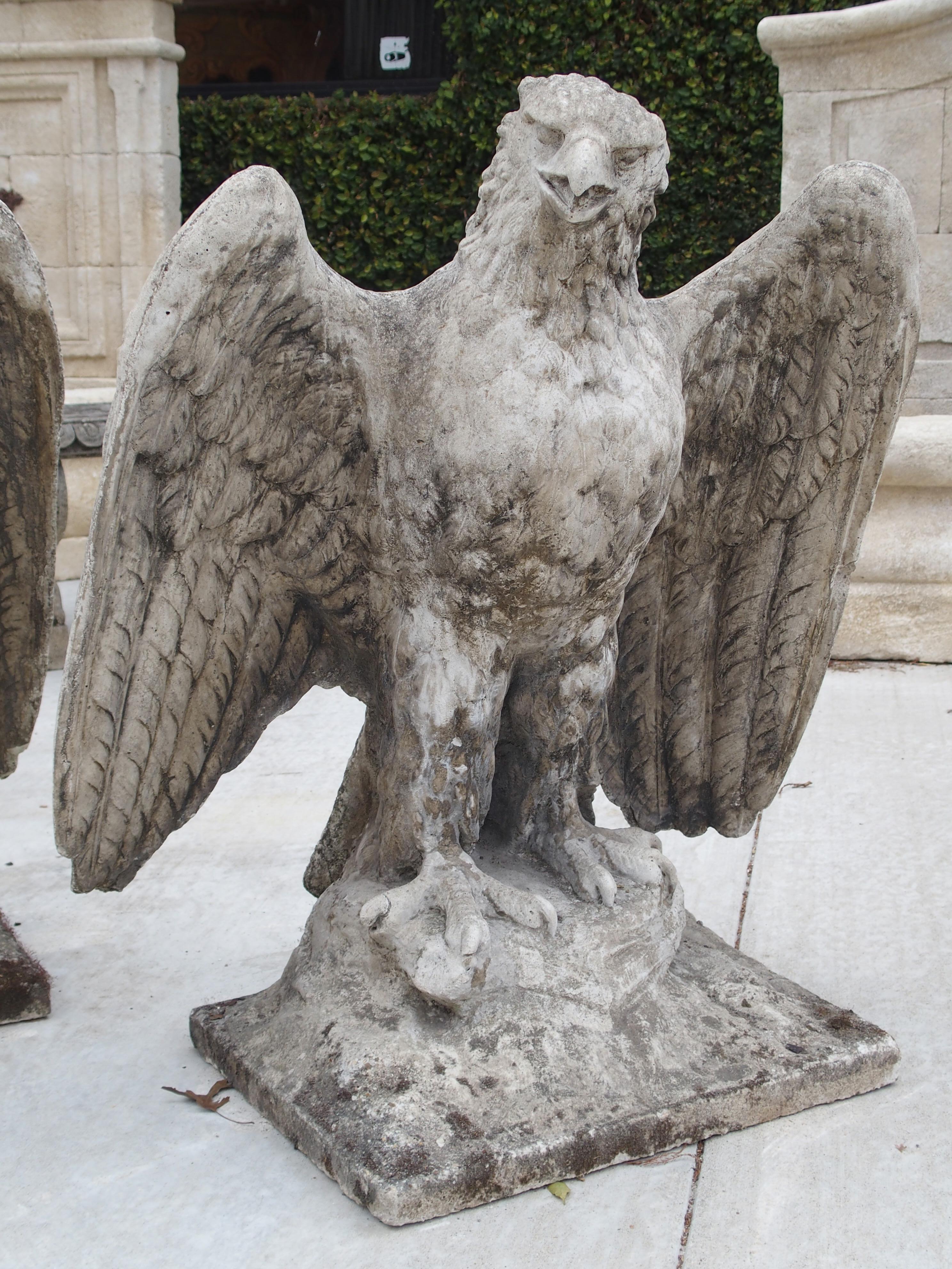 Early 20th Century Pair of Large English Cast Stone Opposing Eagles, circa 1920s