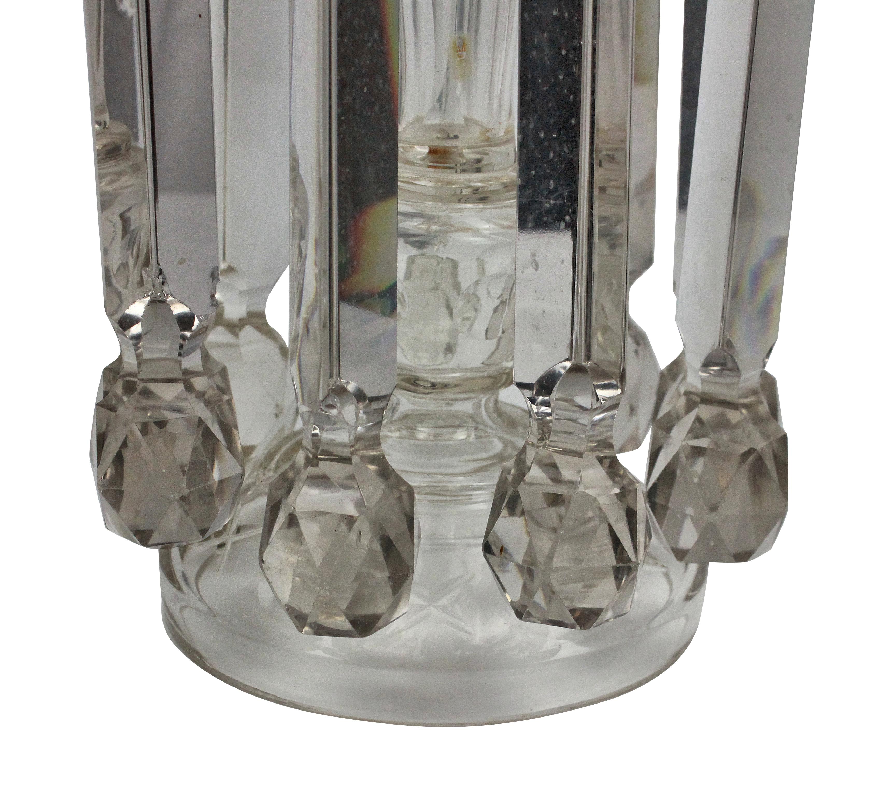A pair of large English, early 19th century table lustre candlesticks of large proportions, hung with good quality cut glass.