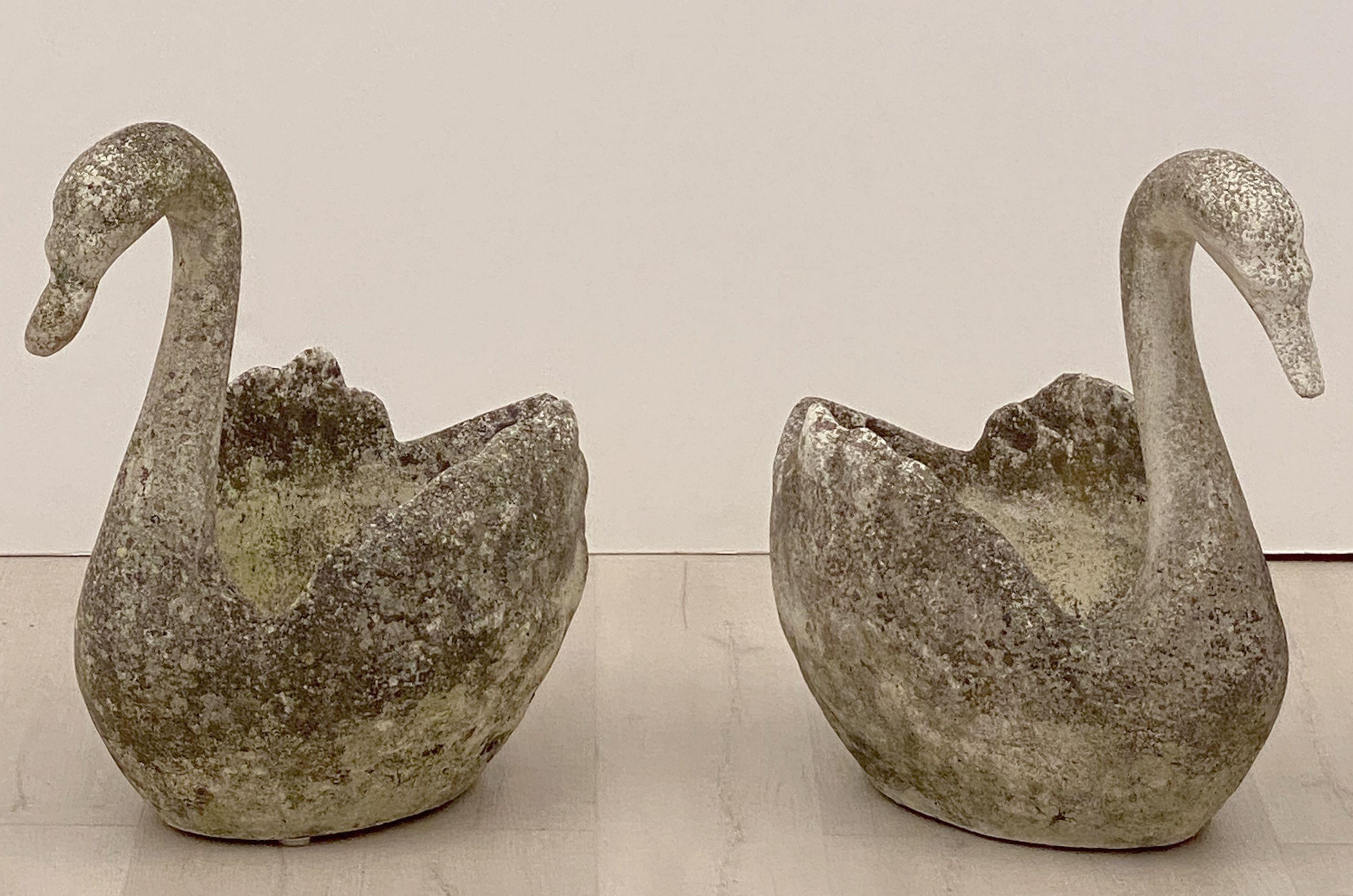 A fine pair of large English garden planters in the shape of swans, each featuring an elegant silhouette design of cast stone.

Two available - Individually Priced - $3495 each swan planter