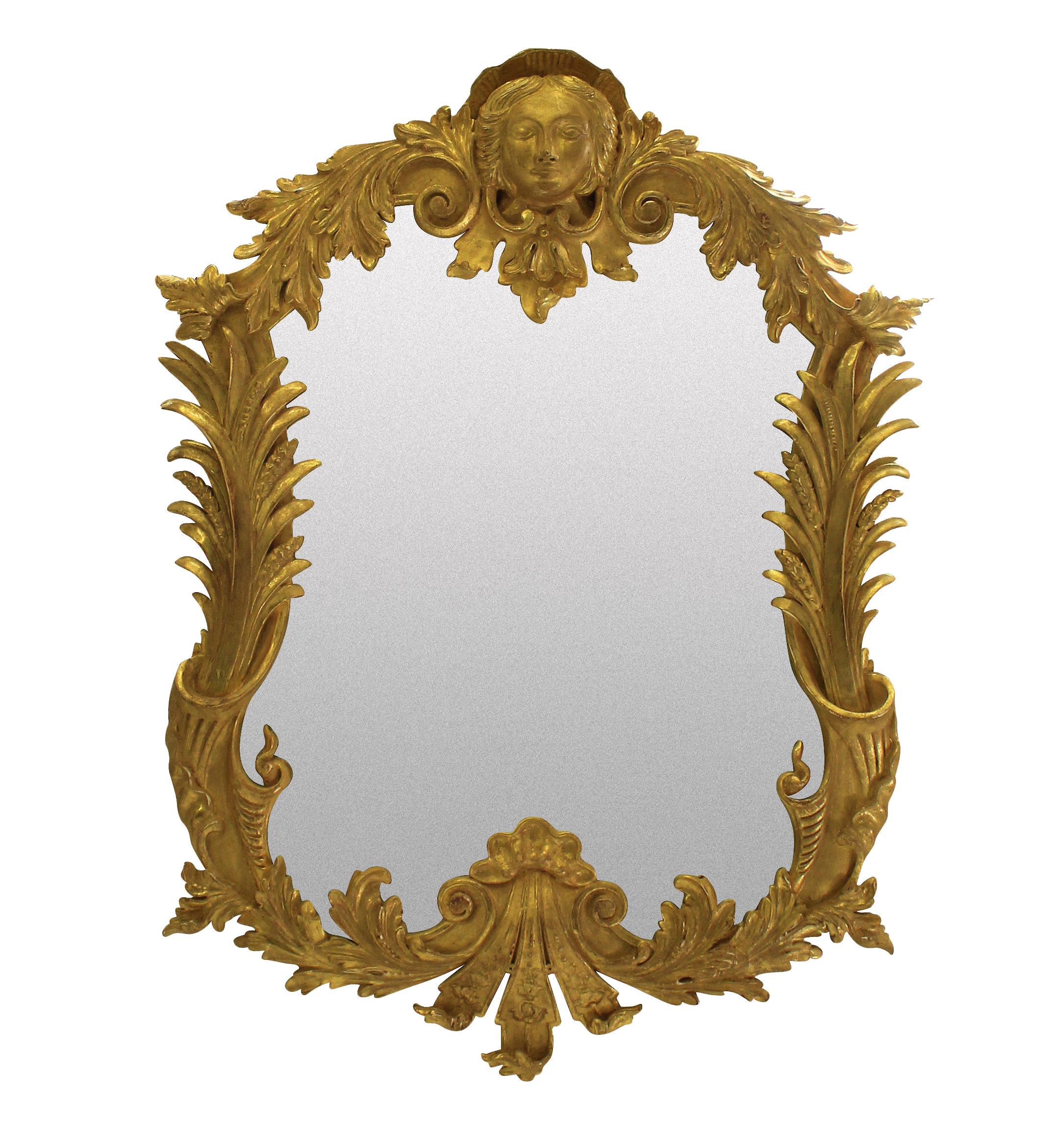 A pair of large carved and water gilded George III style classically inspired mirrors.
  