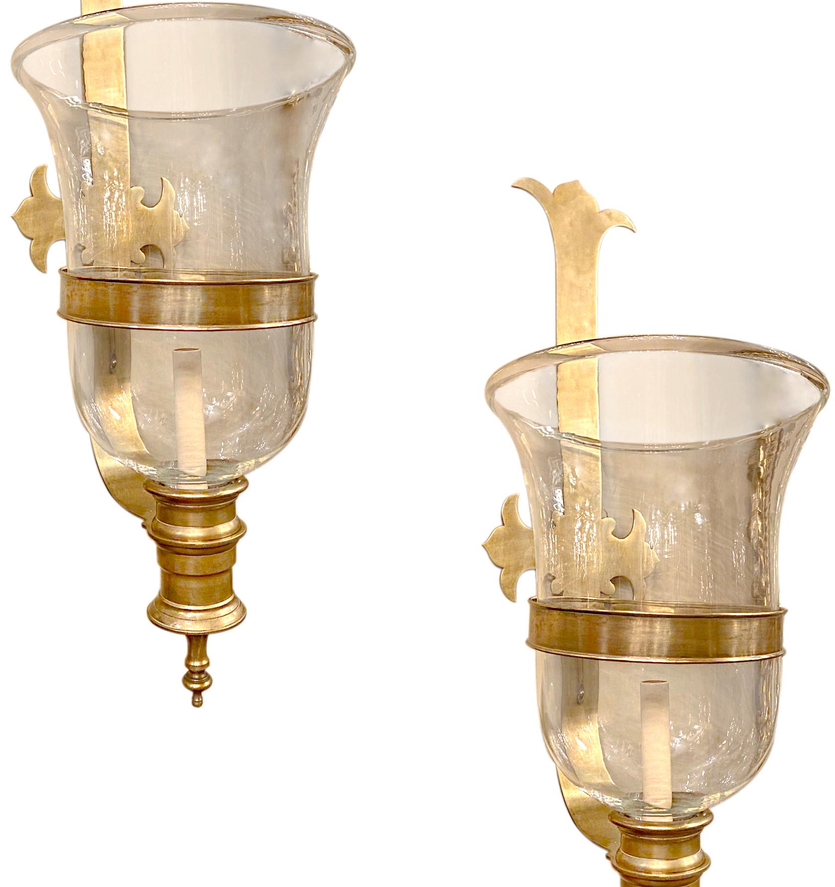 A pair of large circa 1960's English glass bell jar sconces with bronze hardware and single interior light.

Measurements:
Height: 30
