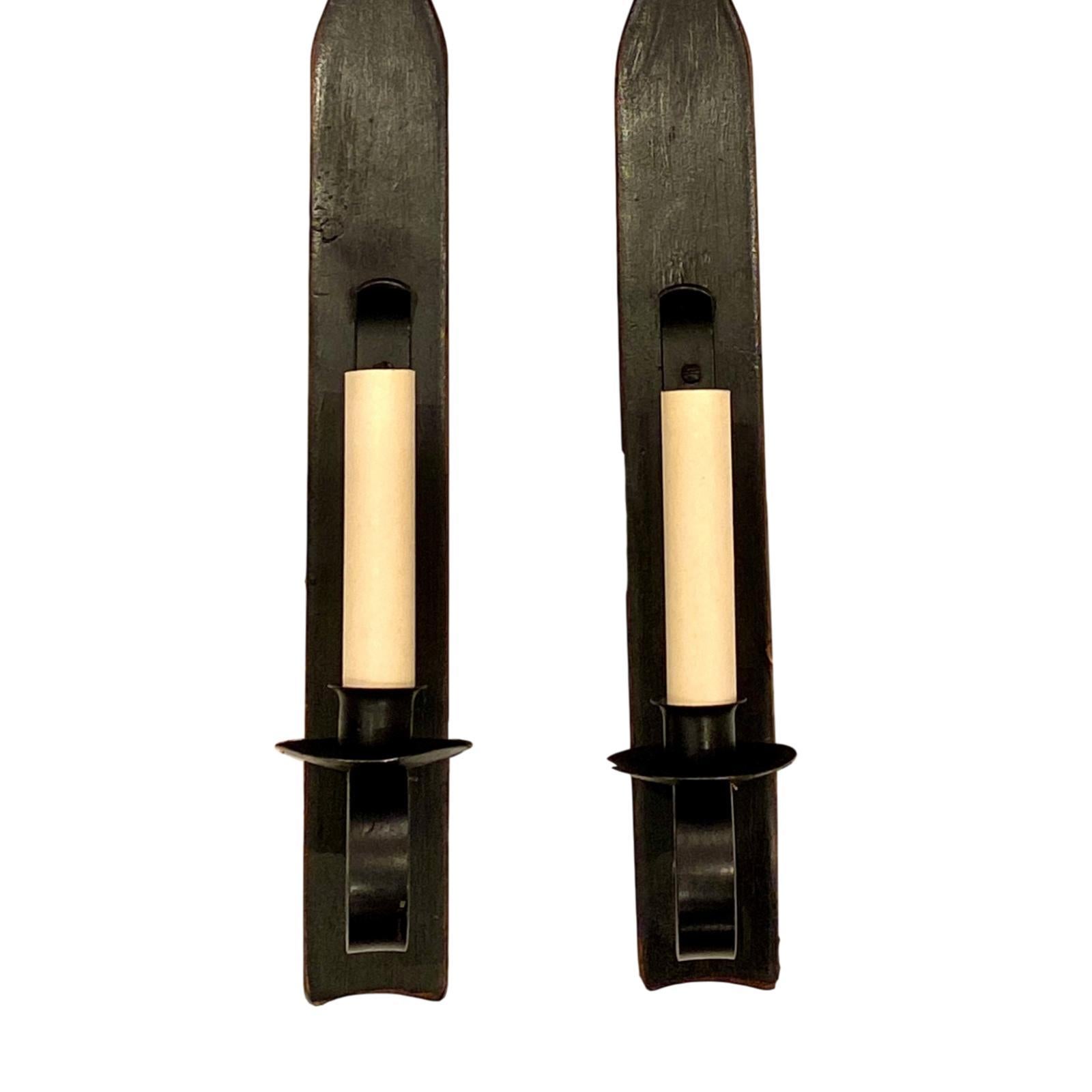 A pair of large circa 1940s English single-light carved and painted wood sconces with iron hardware.

Measurements:
Height 27?
Width 4?
Depth 4?