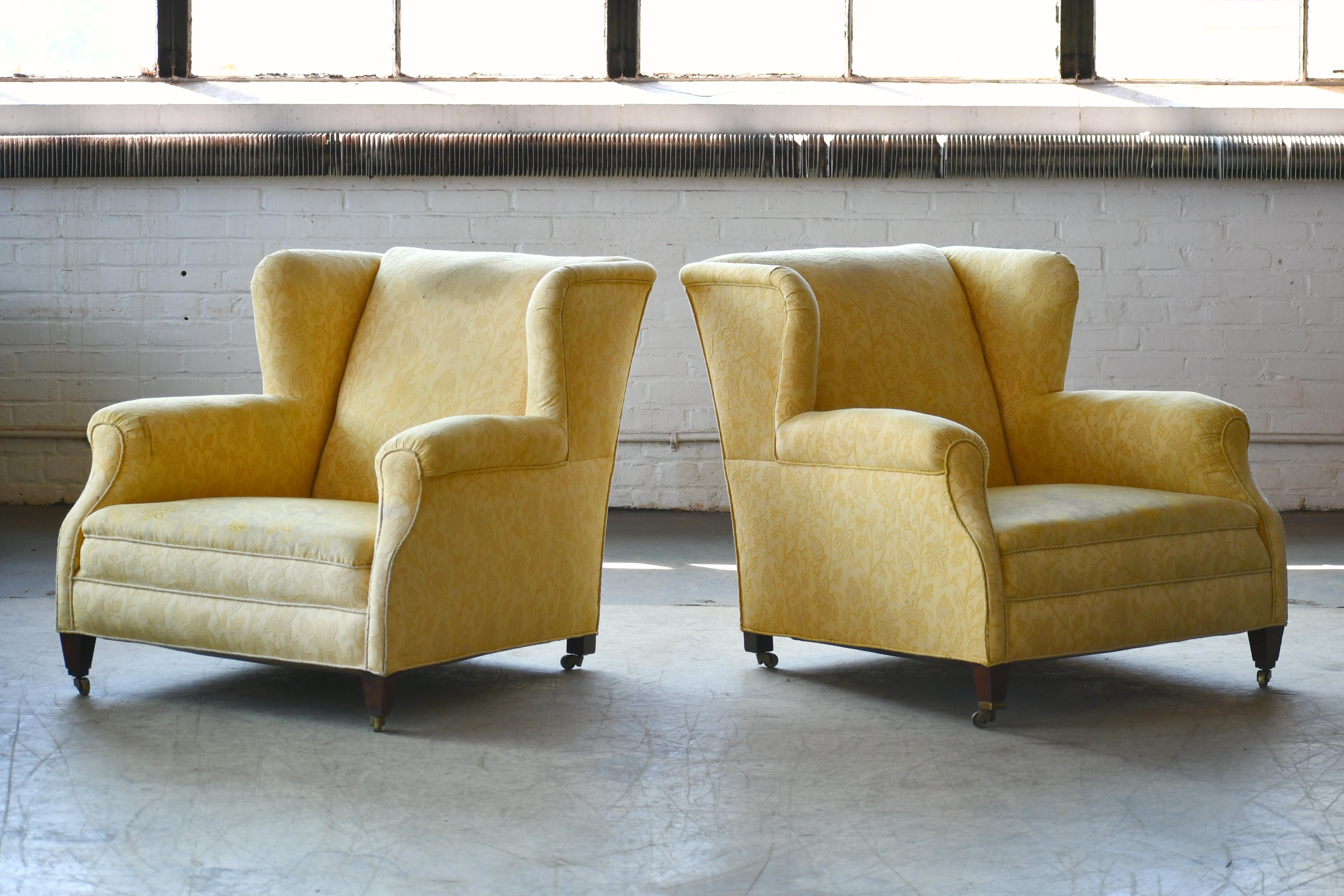 Superbly stylish pair of oversized club chairs and based on style, construction and condition probably made around 1950. The style is very English but we found them in Denmark and they are most likely Danish. The Silhouette is a little bit Fritz