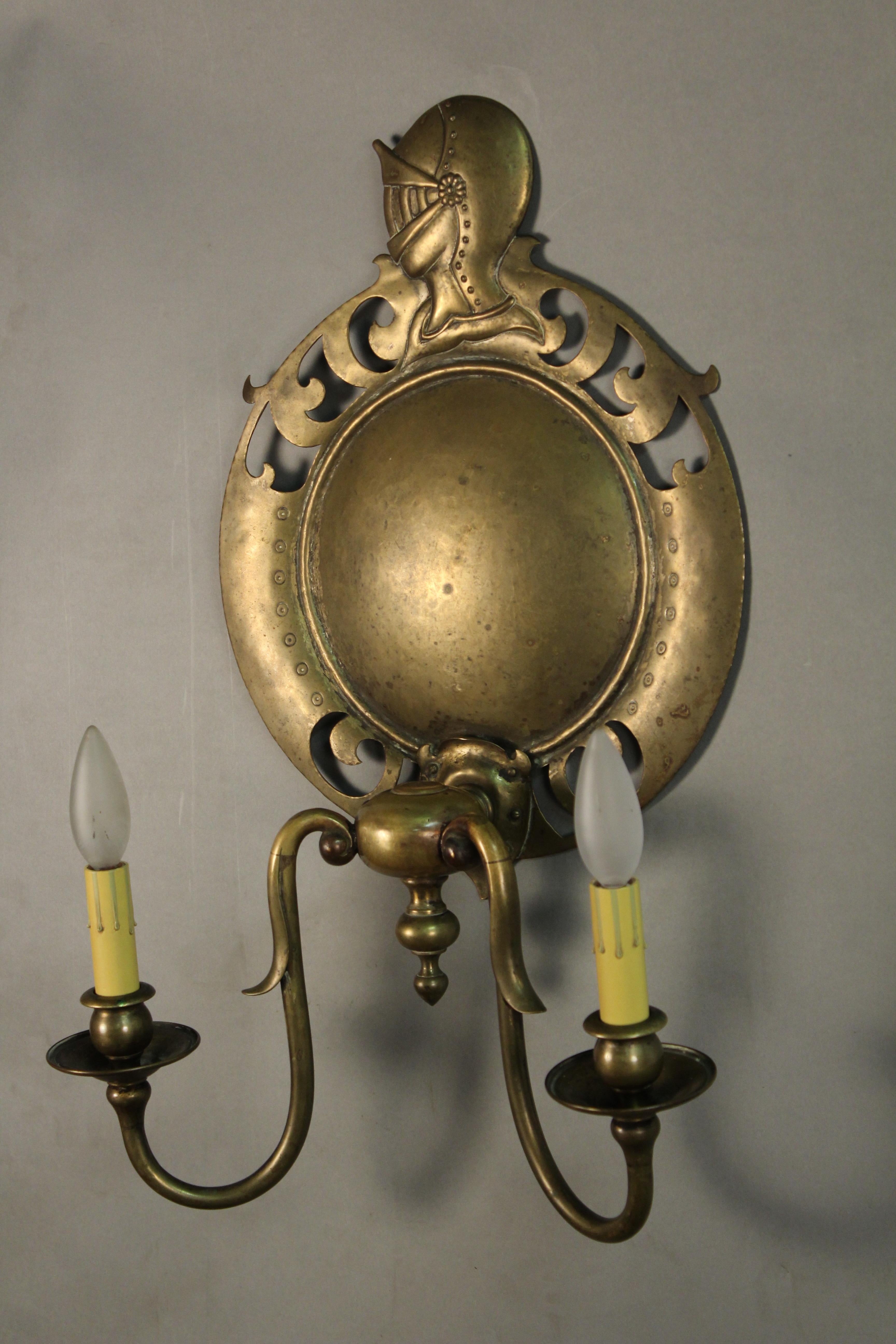 Antique pair pf large brass 1920s sconces with knights.