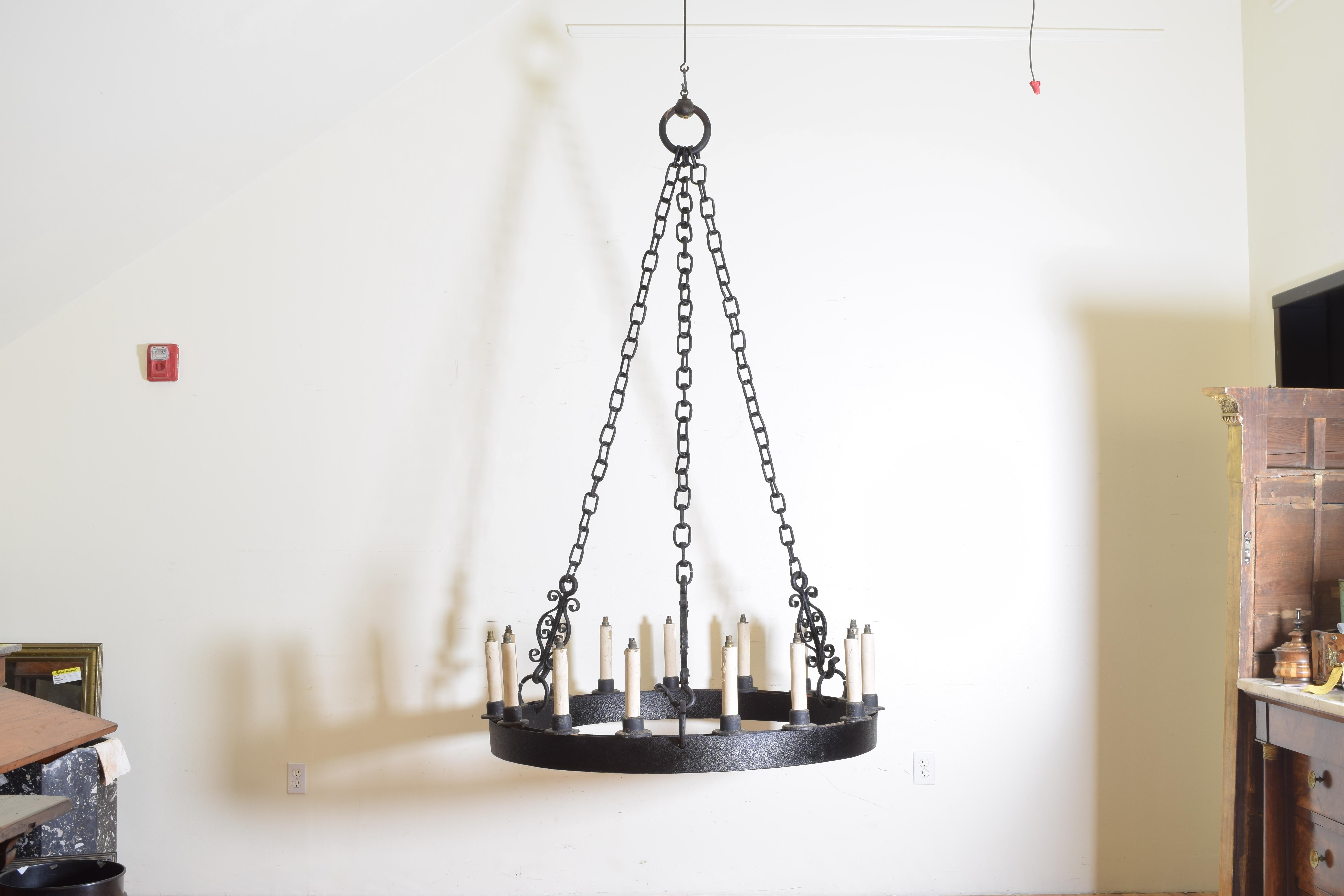 Formerly having original gas lines within the round frames, these large ring chandeliers retain their original chains and connectors, the chains with round openings which allowed the iron tubing to travel to the ceiling, having inserted wooden