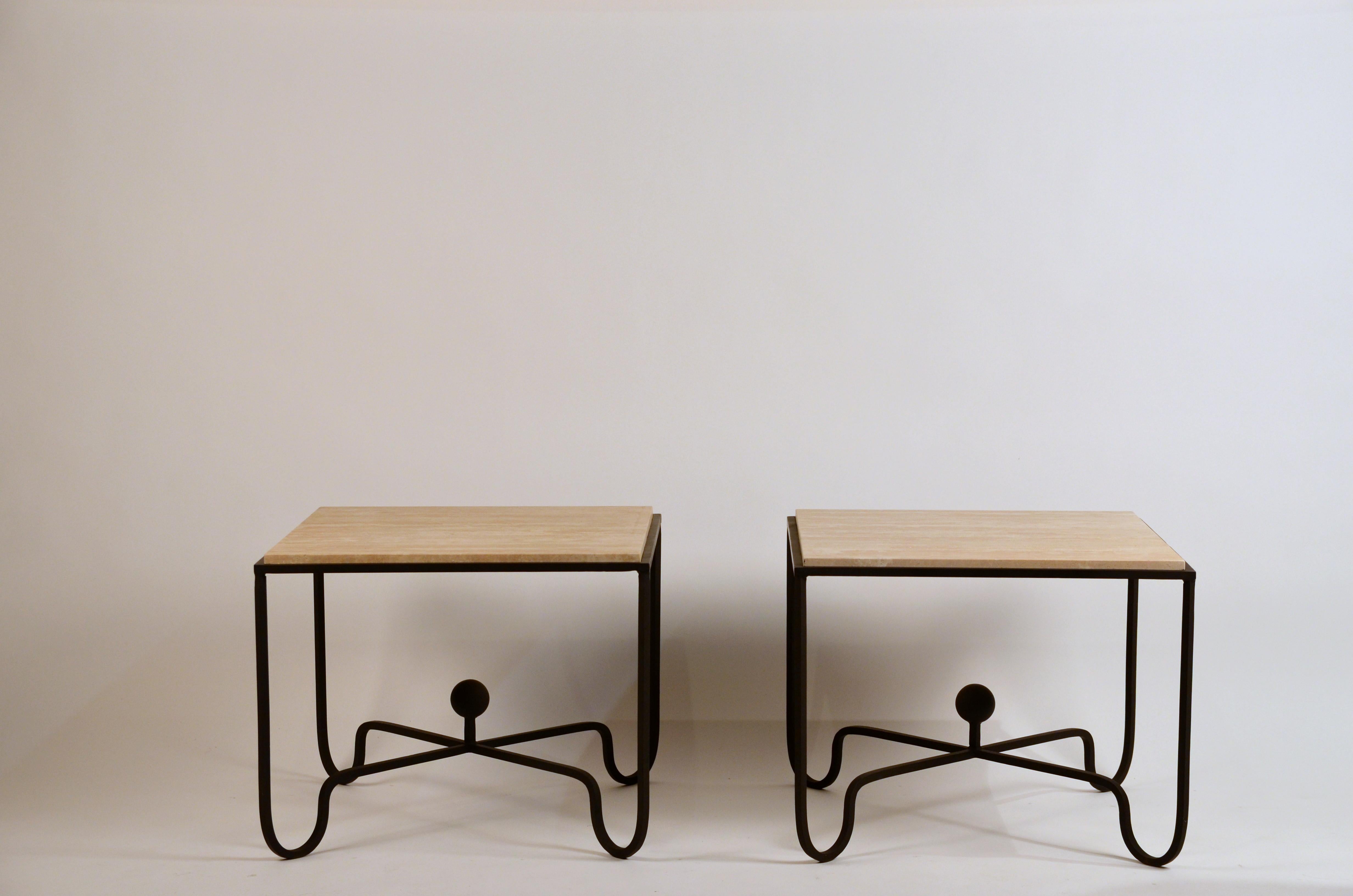 Pair of large 'Entretoise' scream travertine side tables by Design Frères.

Great as sofa end tables or as a 2 part coffee table.

Chic grooved cream travertine tops over matte black wrought iron bases.
   