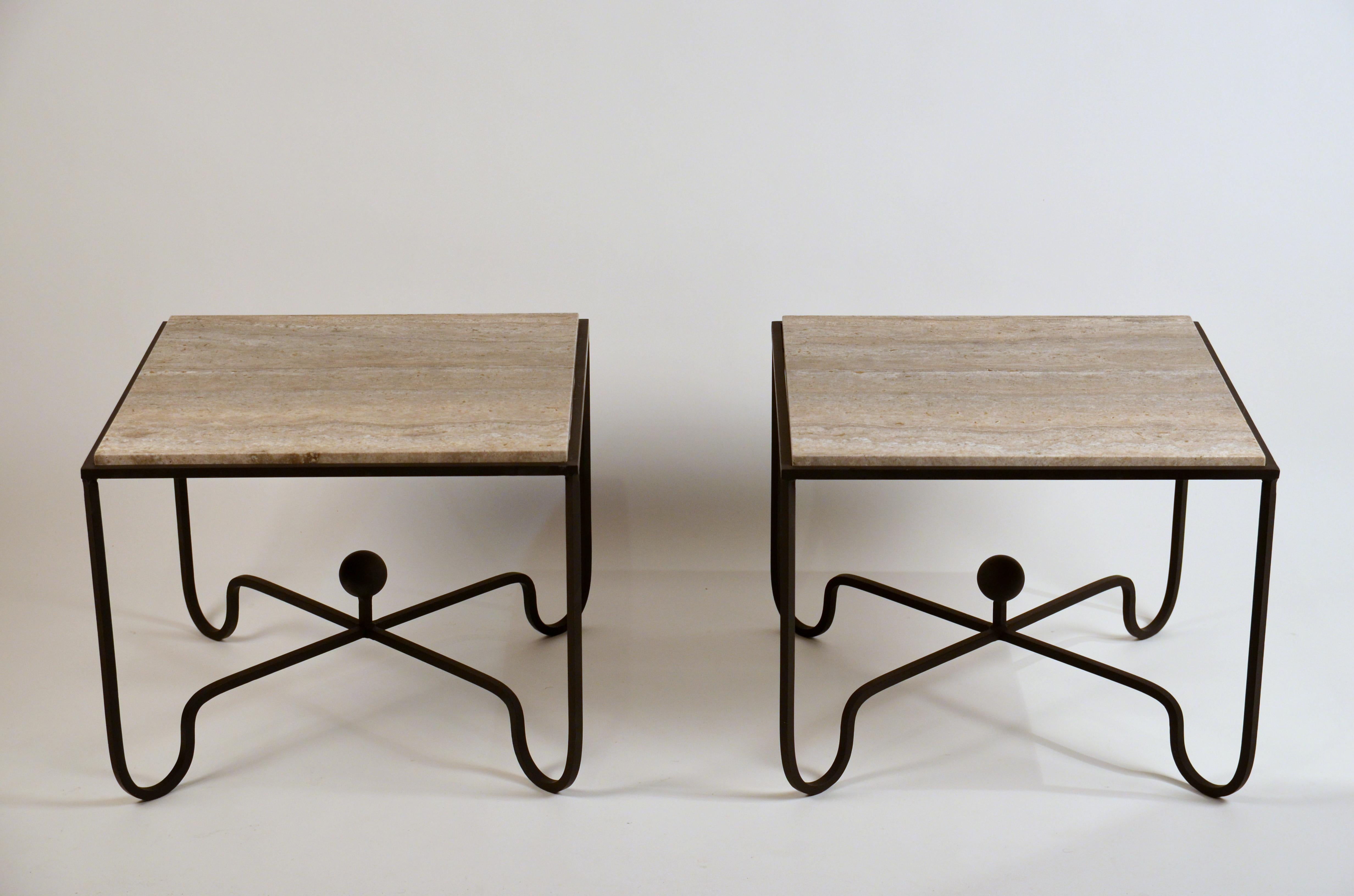 Pair of large 'Entretoise' silver travertine side tables by Design Frères.

Great as sofa end tables or as a 2 part coffee table.

Chic linear veined silver travertine tops over matte black wrought iron bases.