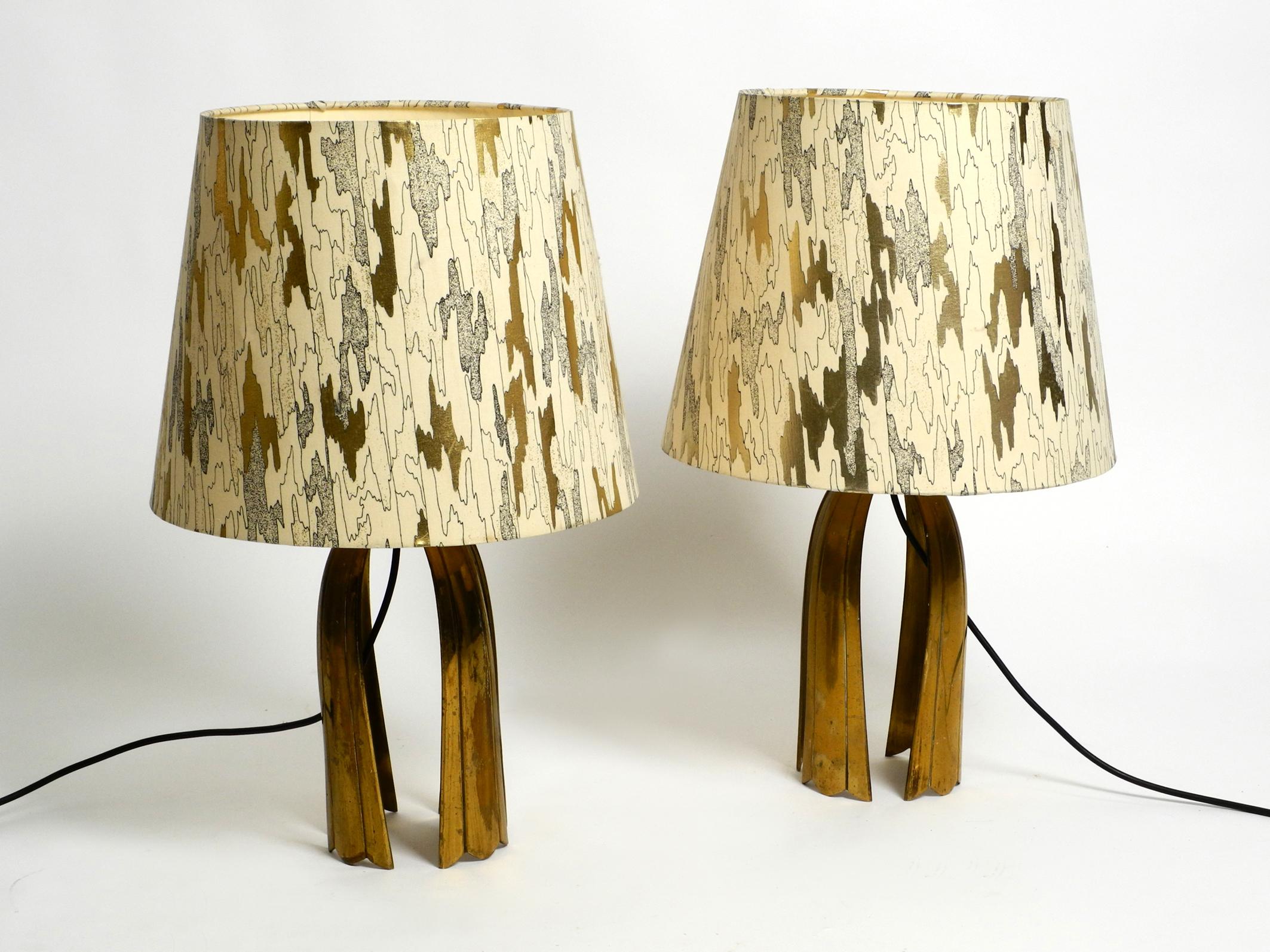 Pair of large stunning Mid Century Modern brass table lamps.
These lamps are so beautiful, the beauty can not be shown in the photos as they are in real.
The large lampshades are not original but also from the 70s and fit perfectly in color and