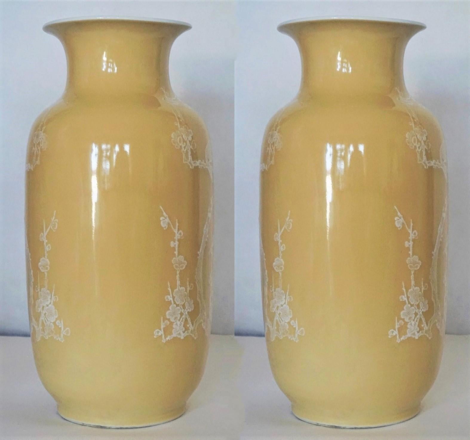 A pair of large, fine Chinese porcelain yellow-ground vases decorated with hand painted birds and floral motifs on both sides, China, early 20th century. Each vase marked at the bottom.
Condition: Both vases in fine original condition, some wear, no