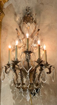 Pair of Large five light iron and crystal sconces with antique finish, wired