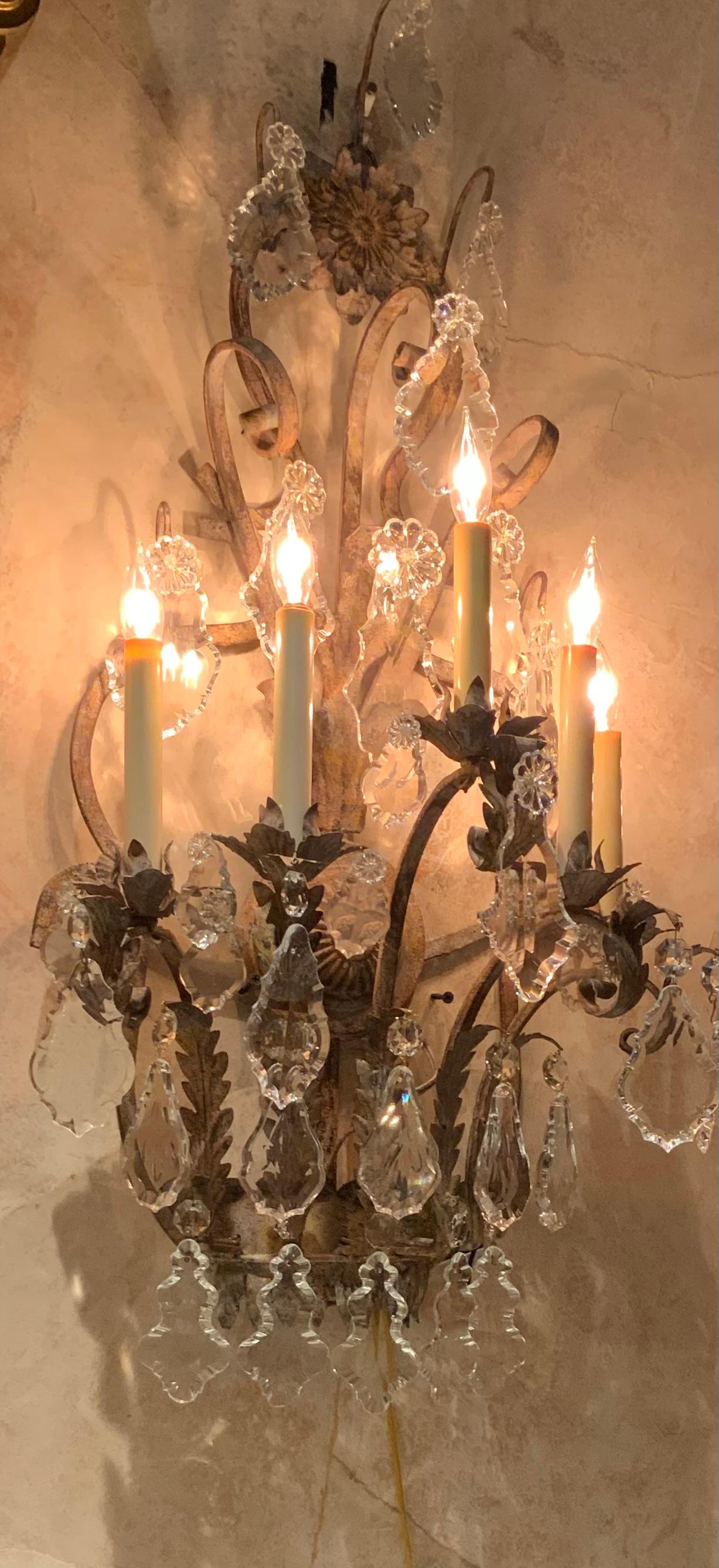 European Pair of Large five light iron and crystal sconces with antique finish, wired For Sale