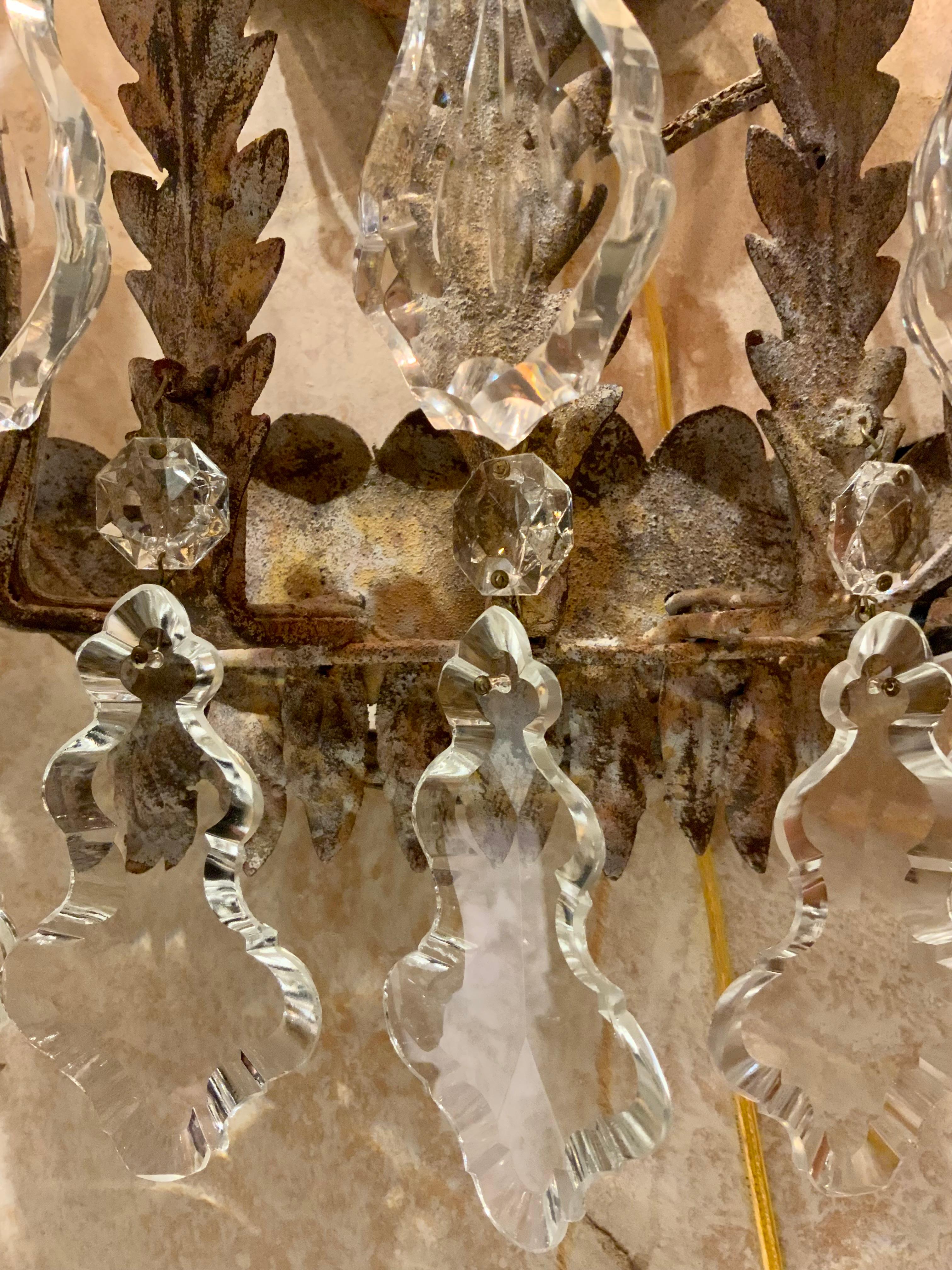 Contemporary Pair of Large five light iron and crystal sconces with antique finish, wired For Sale