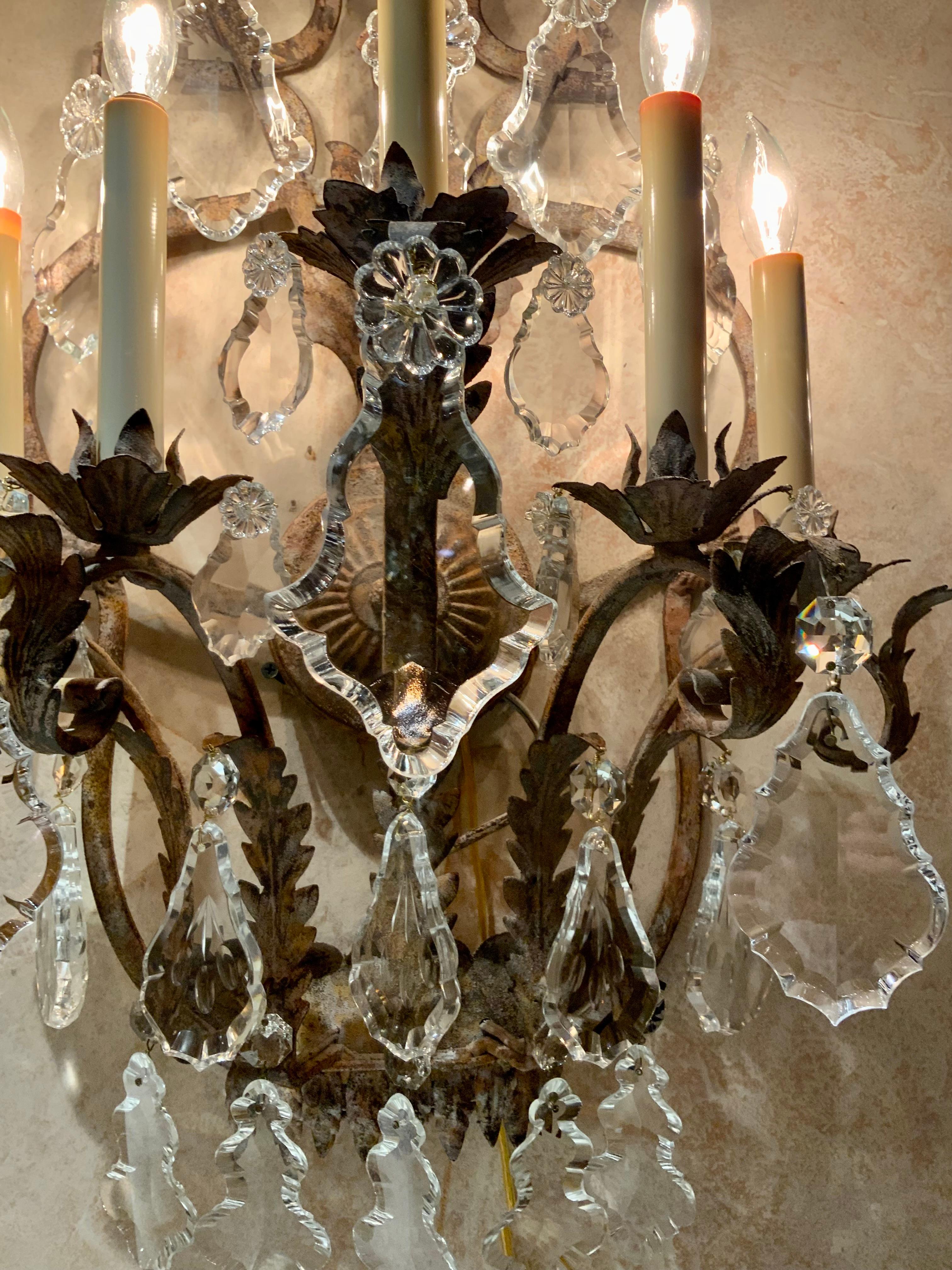 Crystal Pair of Large five light iron and crystal sconces with antique finish, wired For Sale