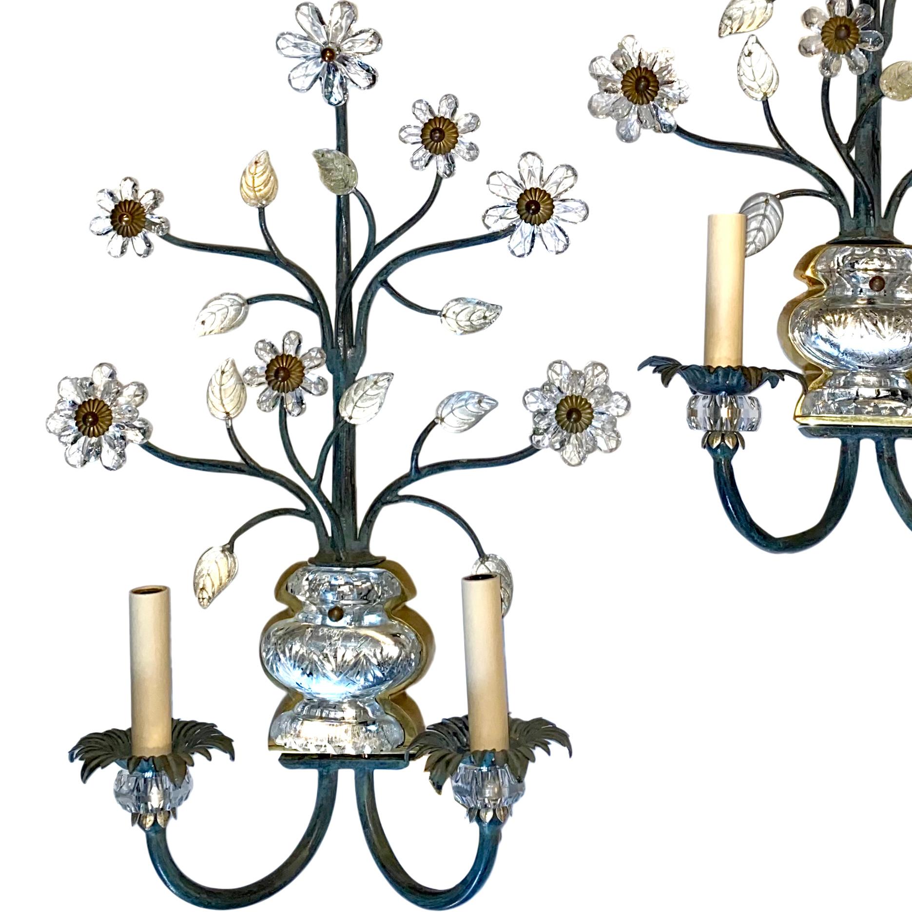 A pair of French circa 1940s painted metal double-light sconces with molded glass body and floral details.

Measurements:
Height 22