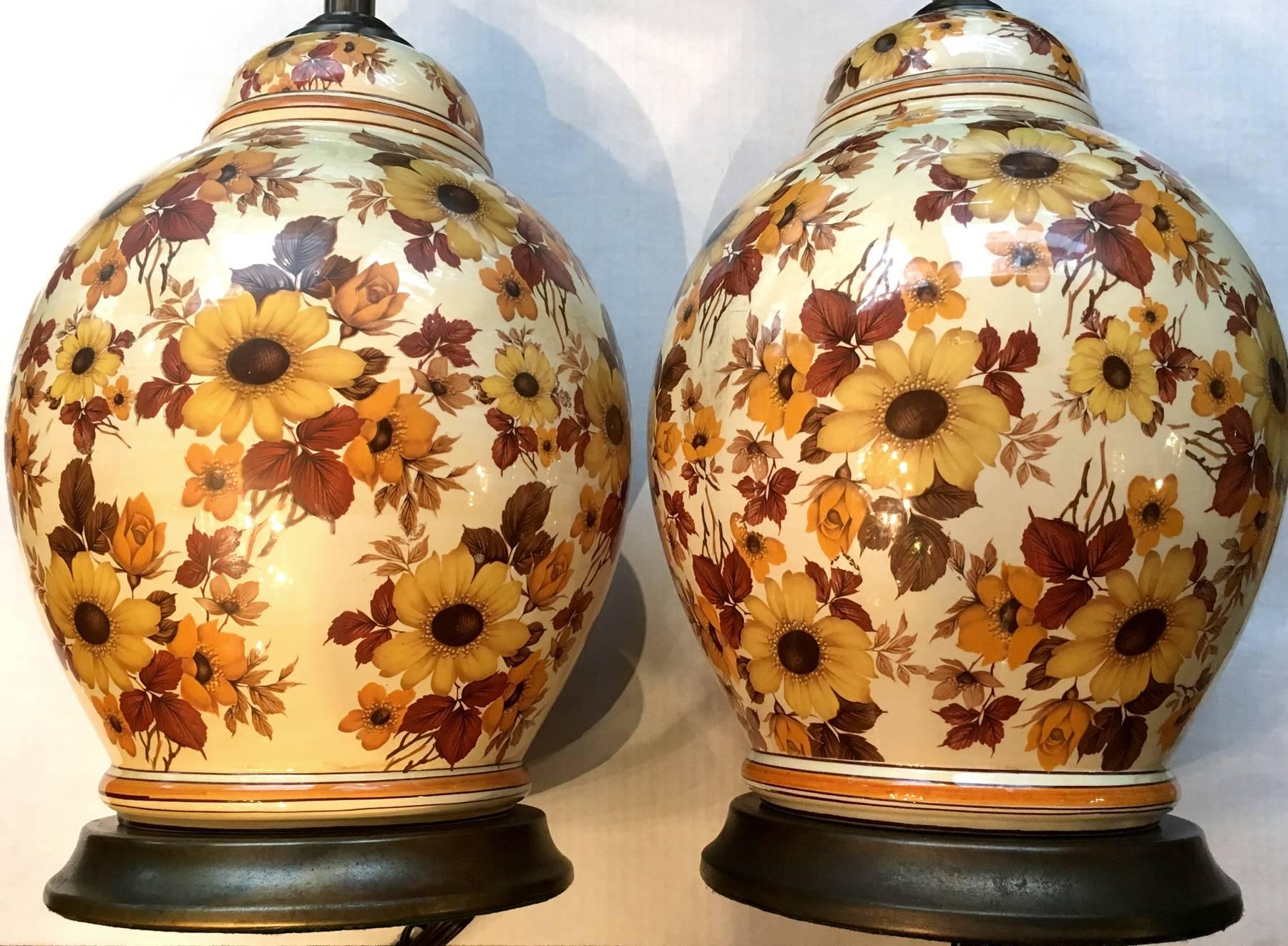 Pair of Italian porcelain lamps with floral decoration on body and with metal bases.
18