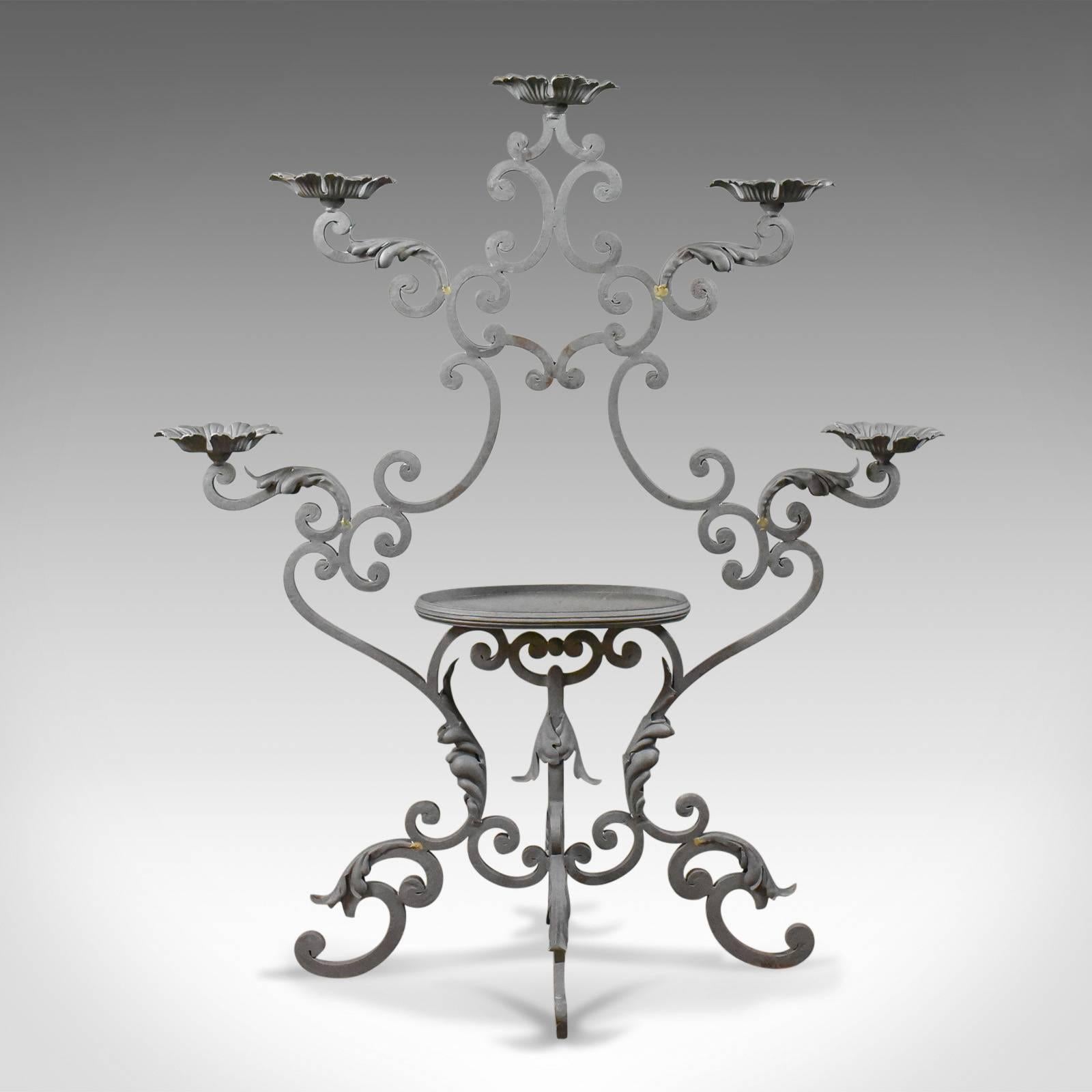 This is a pair of large florist plant stands in painted iron, suitable for inside or outside or as a church candleholder and dating to the late 20th century.

Larger than most and very stable
Attractive 'C' scroll construction
Standing upon four