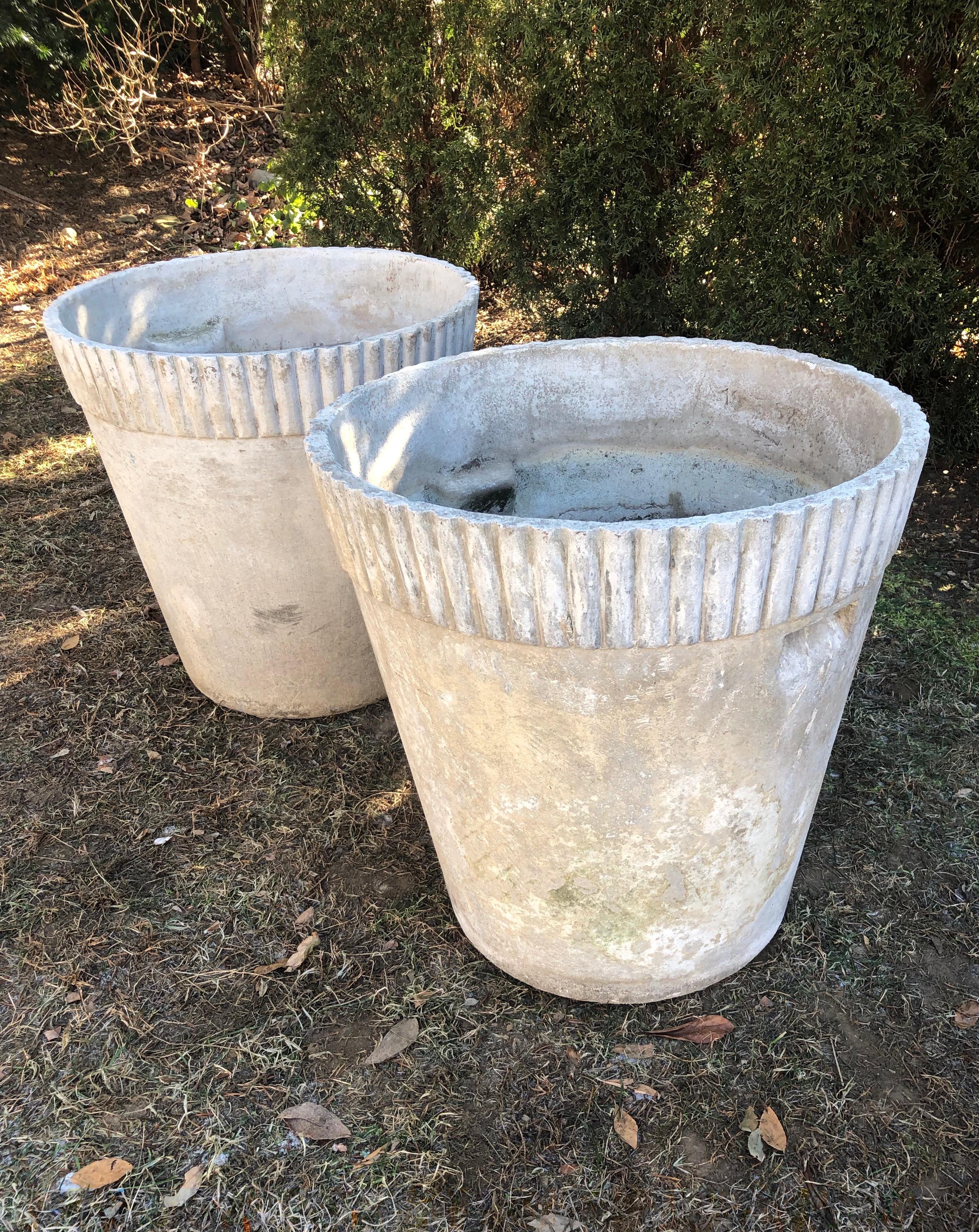 It is rare to find a pair of this form of flower pot planter, designed by Willy Guhl, and produced by Eternit, particularly when one is dated May 3, 1960. In superb structural condition, they feature two inset handles on opposing sides and a lovely