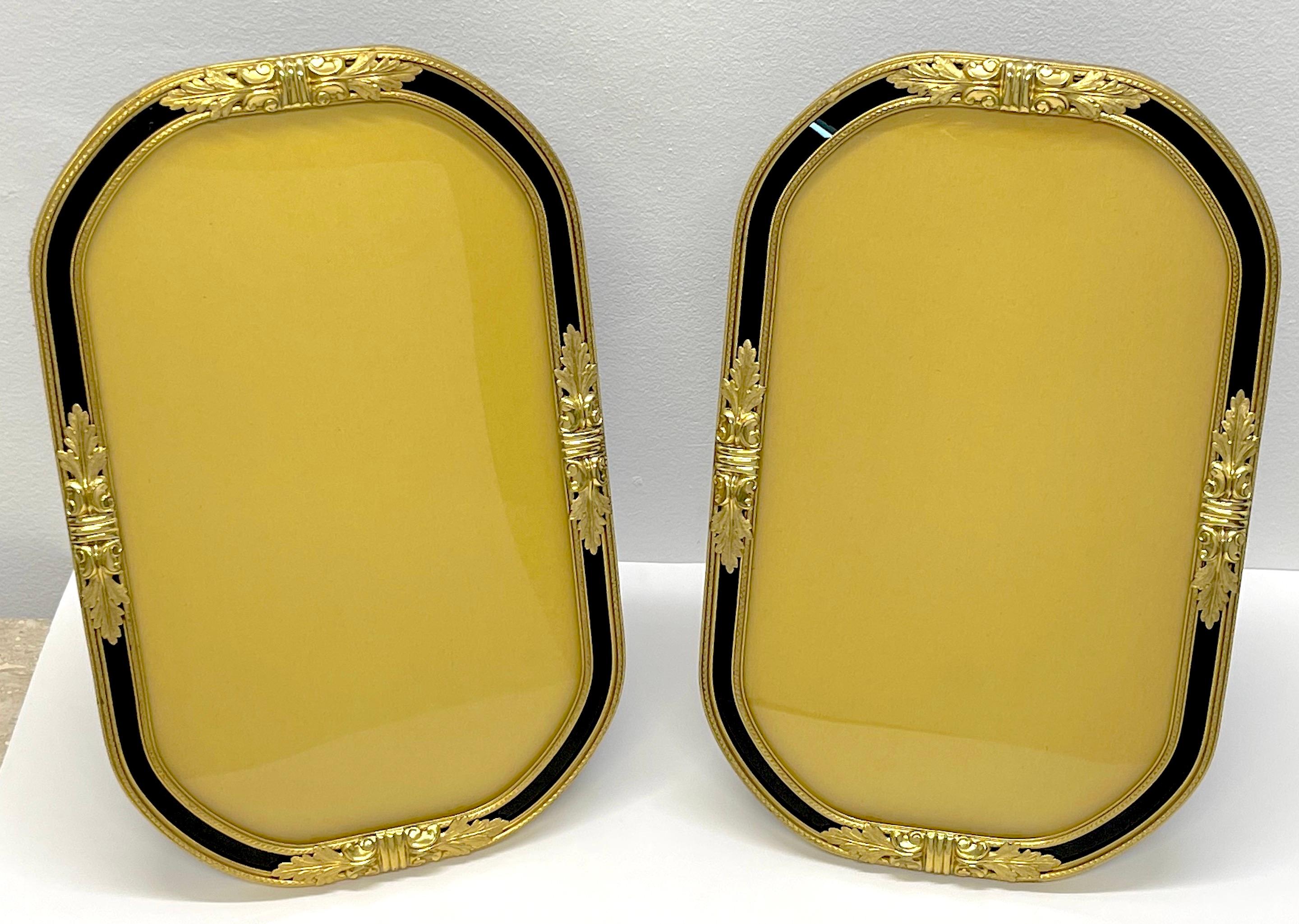 Pair of Large French Belle Époque Neoclassical Ormolu & Enameled Glass Frames
France, circa 1910

A rare find, a stunning matched pair of large ormolu/gilt bronze frames with the original convex (bubble) enameled glass. 
Each frame stands