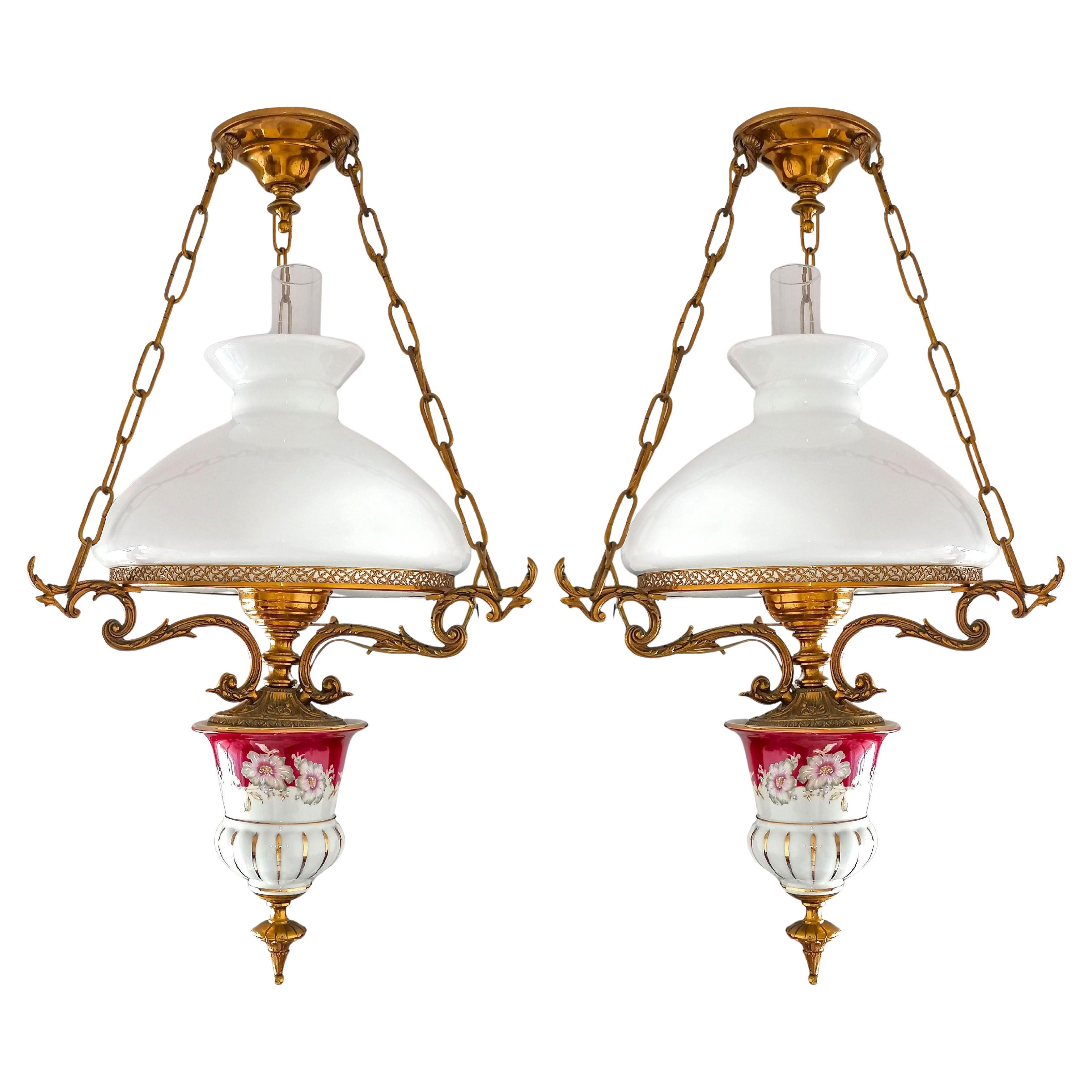 Gorgeous porcelain chandelier in gilt cast bronze Victorian library hanging oil lamp and opaline glass shade. Also have a large matching chandelier. Price per unit. 

Materials: 
Opaline glass. 
Red Pink & Gilt hand painted porcelain 
Adorned solid