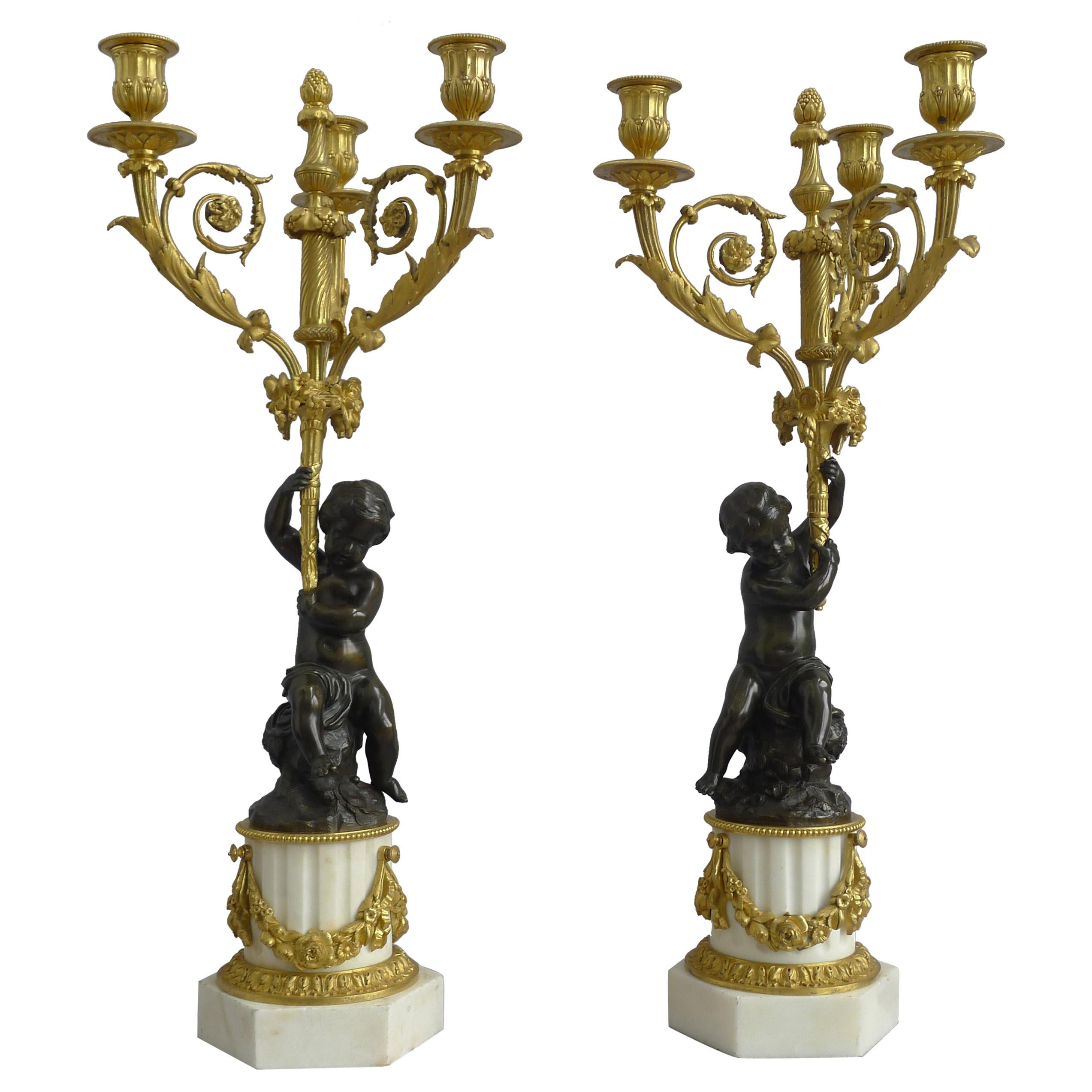 Pair of Large French Figural Candelabra in Patinated Bronze, Ormolu and White Ma