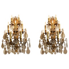Pair of large French gilt bronze and crystal wall sconces