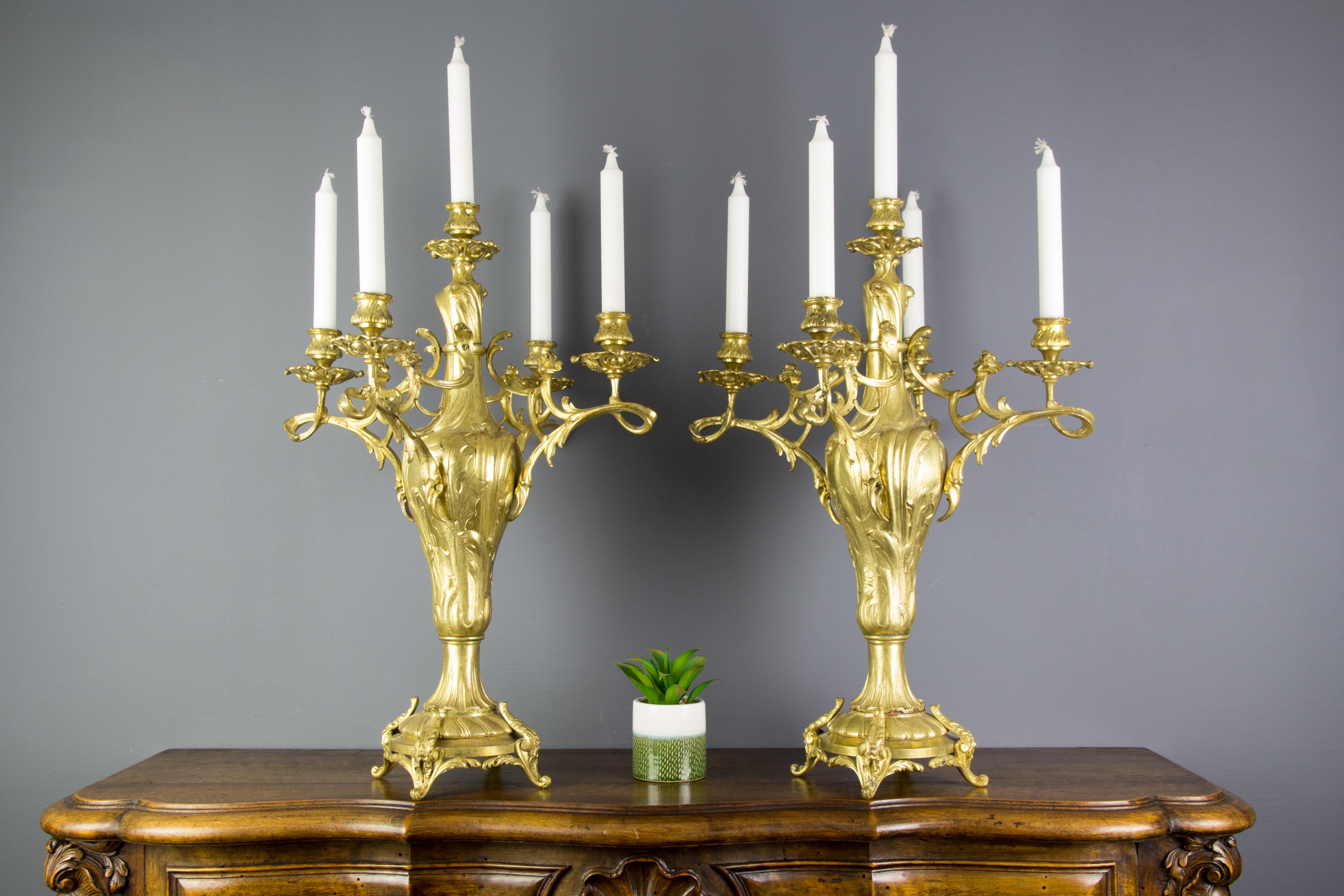 Large and impressive pair of Louis XV or Rococo style bronze five-light candelabras, France, 1920s.
Decorated with floral and scrolled leaf motif throughout.
Dimensions: Height 60 cm / 23.62 in, width 35 cm / 13.77 in, depth 35 cm / 13.77 in.