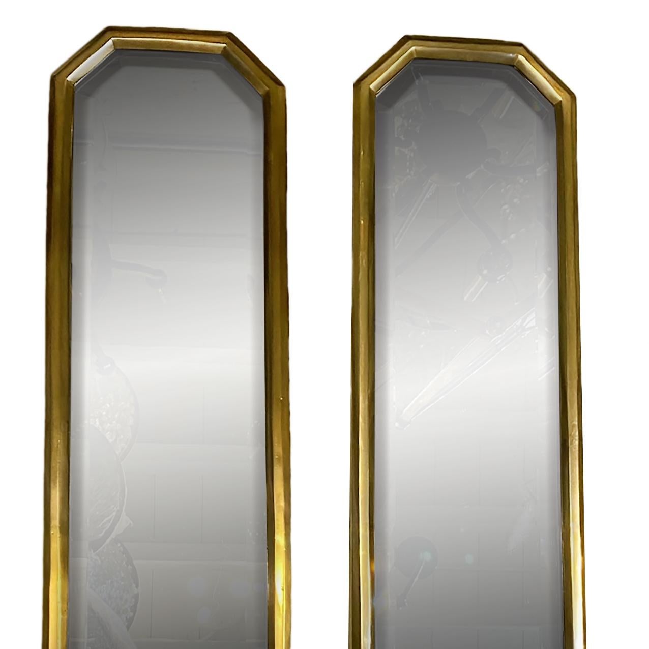 A pair of tall circa 1950's French gilt bronze single light beveled mirror sconces.

Measurements:
Height 32
