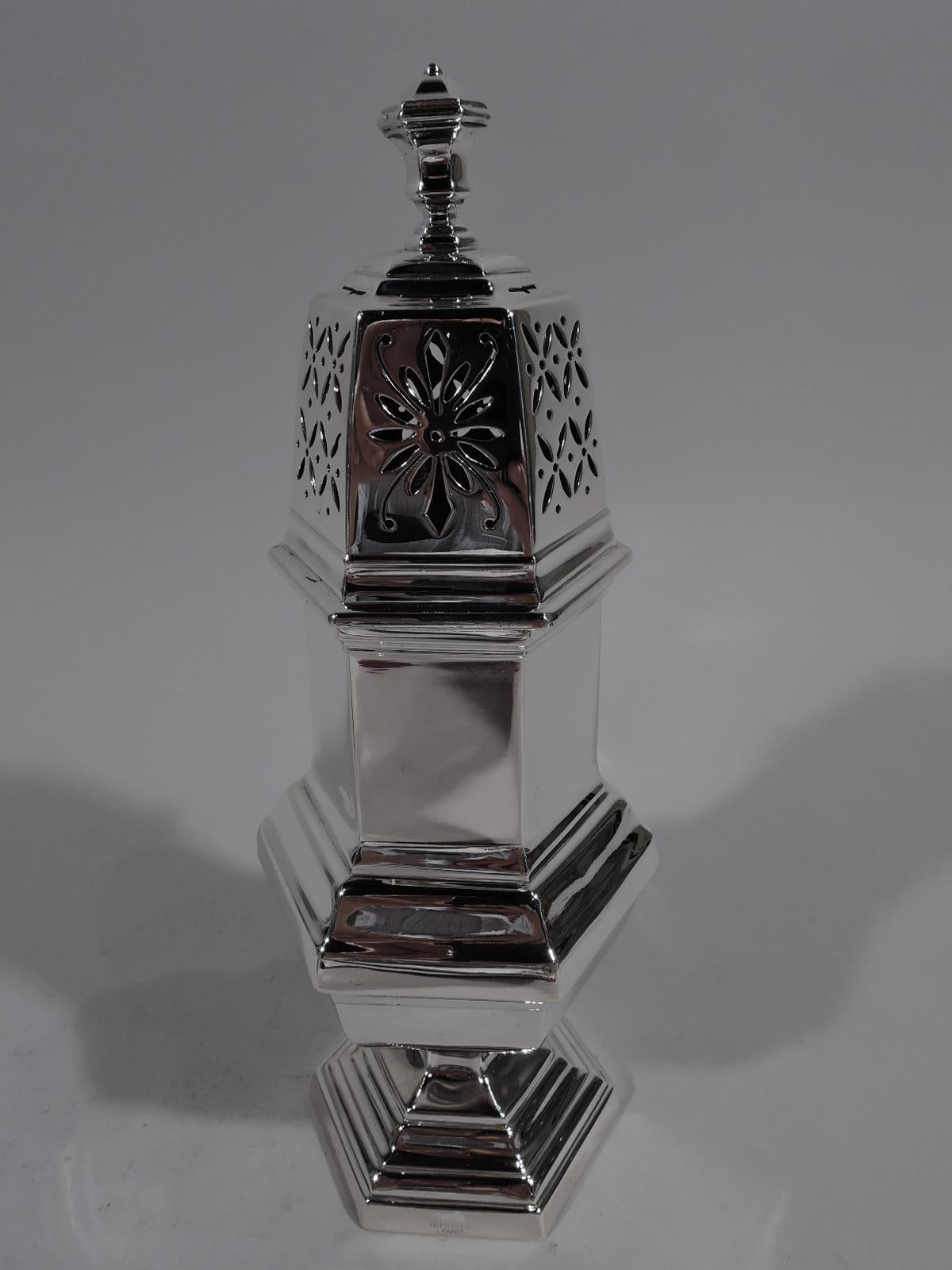 Pair of large modern Classical 950 silver sugar casters. Made by Tetard Frères in Paris, circa 1920. Each: Faceted hexagonal form with baluster body and stepped foot. Threaded domed cover with vase finial. Sides have stylized floral piercing in