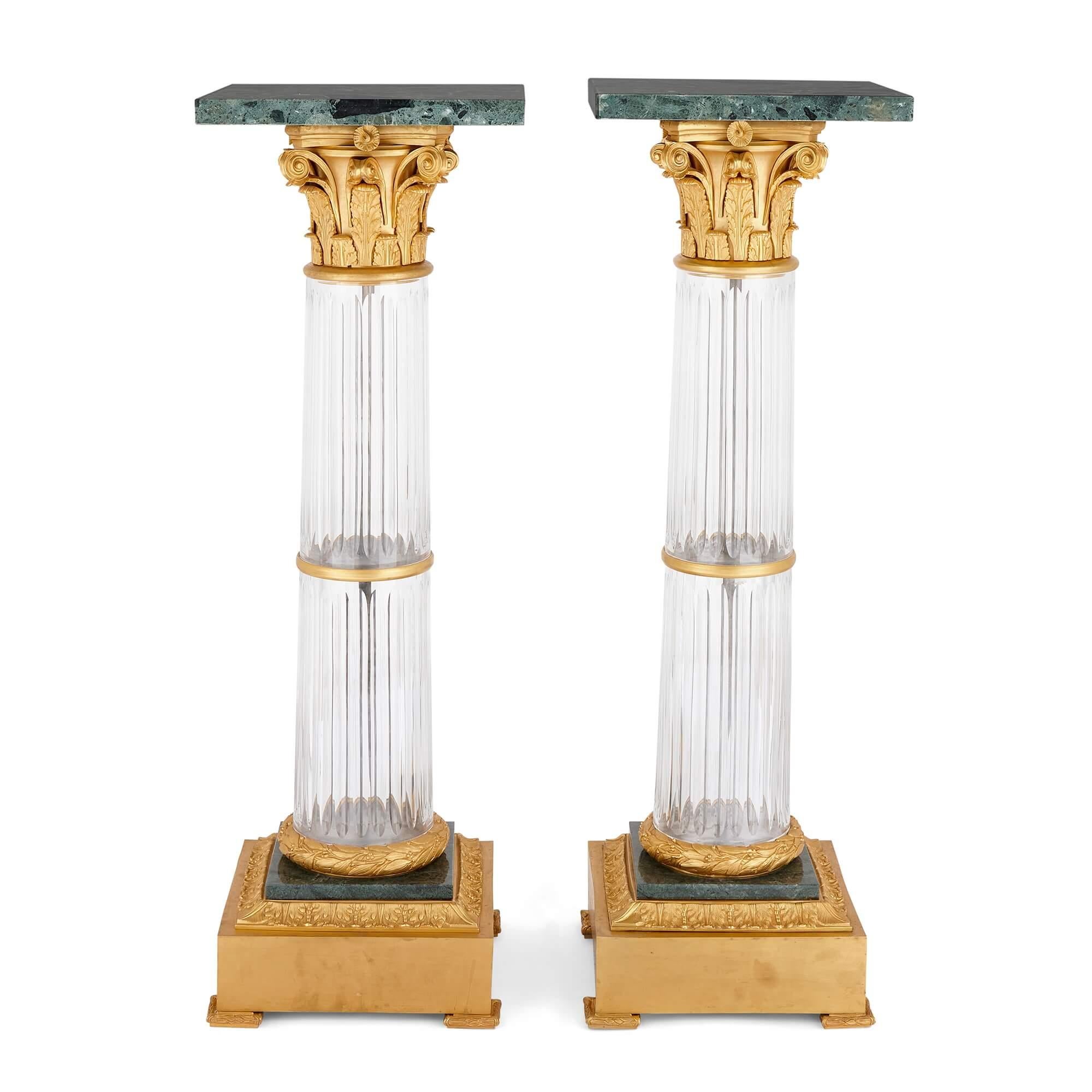 Pair of large French Neoclassical ormolu, glass and marble pedestals
French, 20th century
Height 112.5cm, width 36cm, depth 36cm

These exceptional pieces are a pair of large French pedestals, in the form of Corinthian columns, crafted from