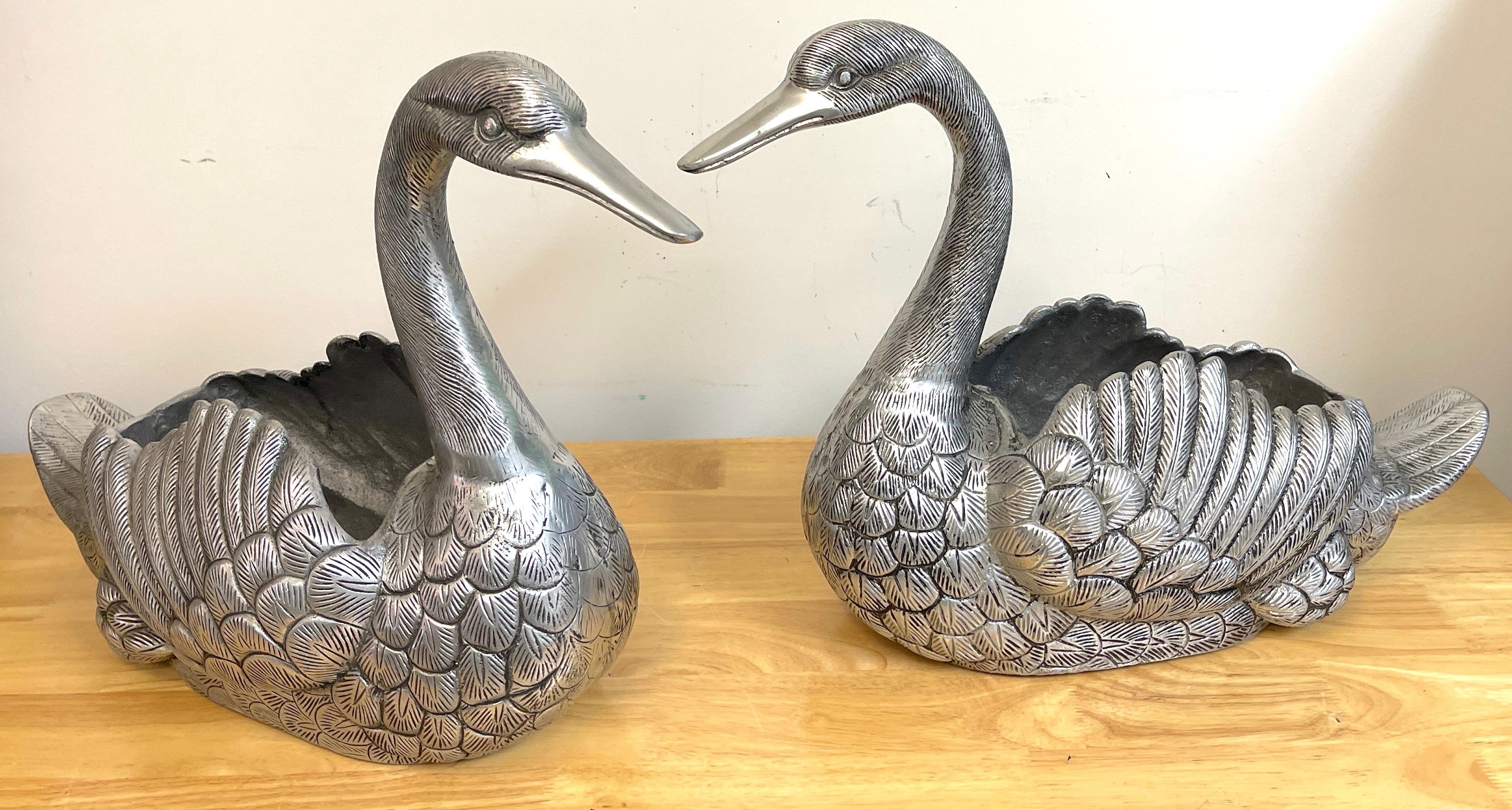 Pair of large French pewter Swan cachepots, Each one realistically cast and modeled, slightly different.
Each swan measures 16' W x 14.5