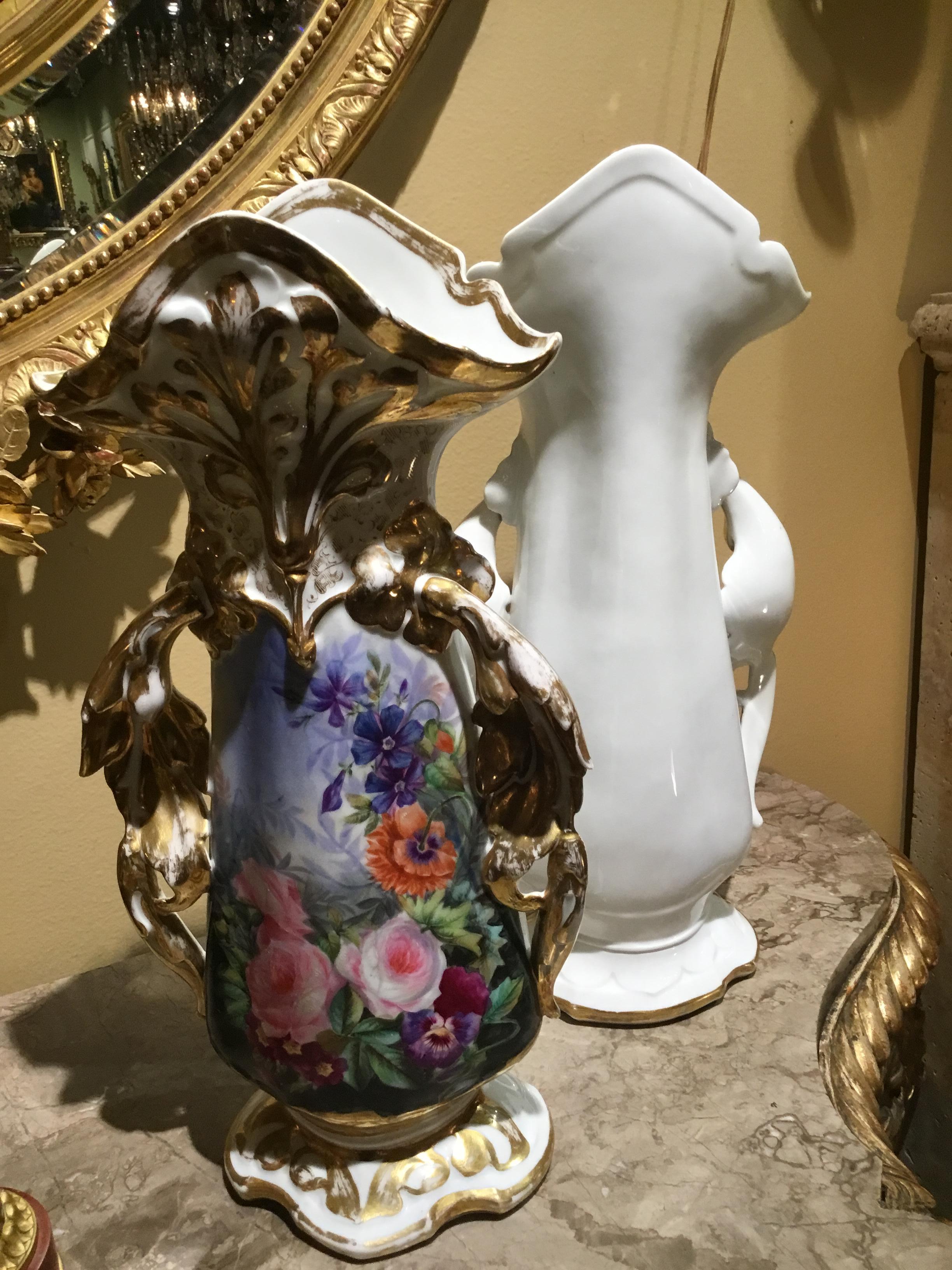 Beautiful shape with scrolled arms; hand painted with colorful floral and
Foliate designs. Gilt embellishments enhance the designs.