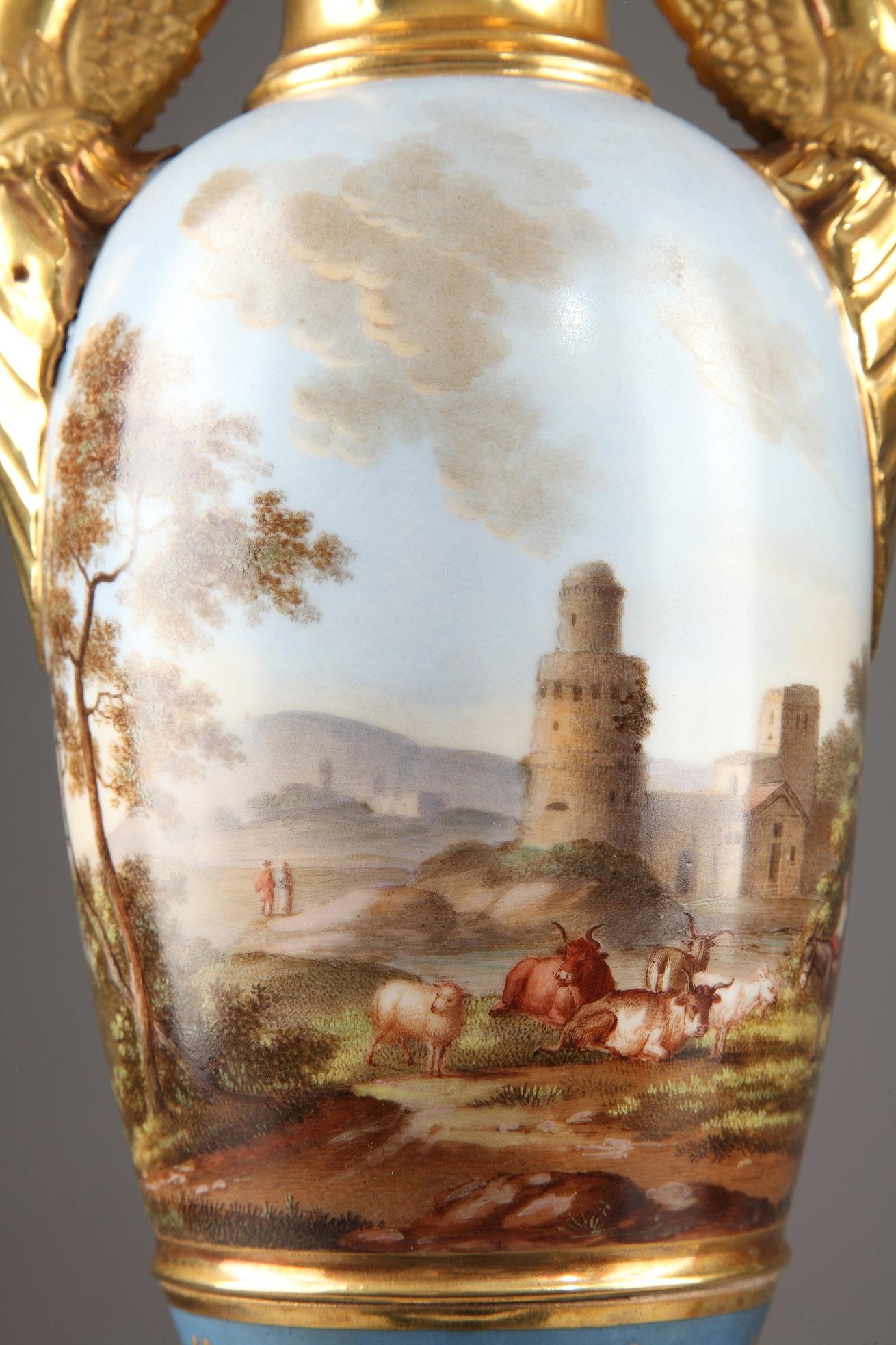 Large pair of painted fuseau vases in Porcelaine de Paris from the Empire period. The neck and the pedestal of the vases are in burnished gold and feature laurel crowns and stylized palmettes. The paunch of each vase is embellished with a