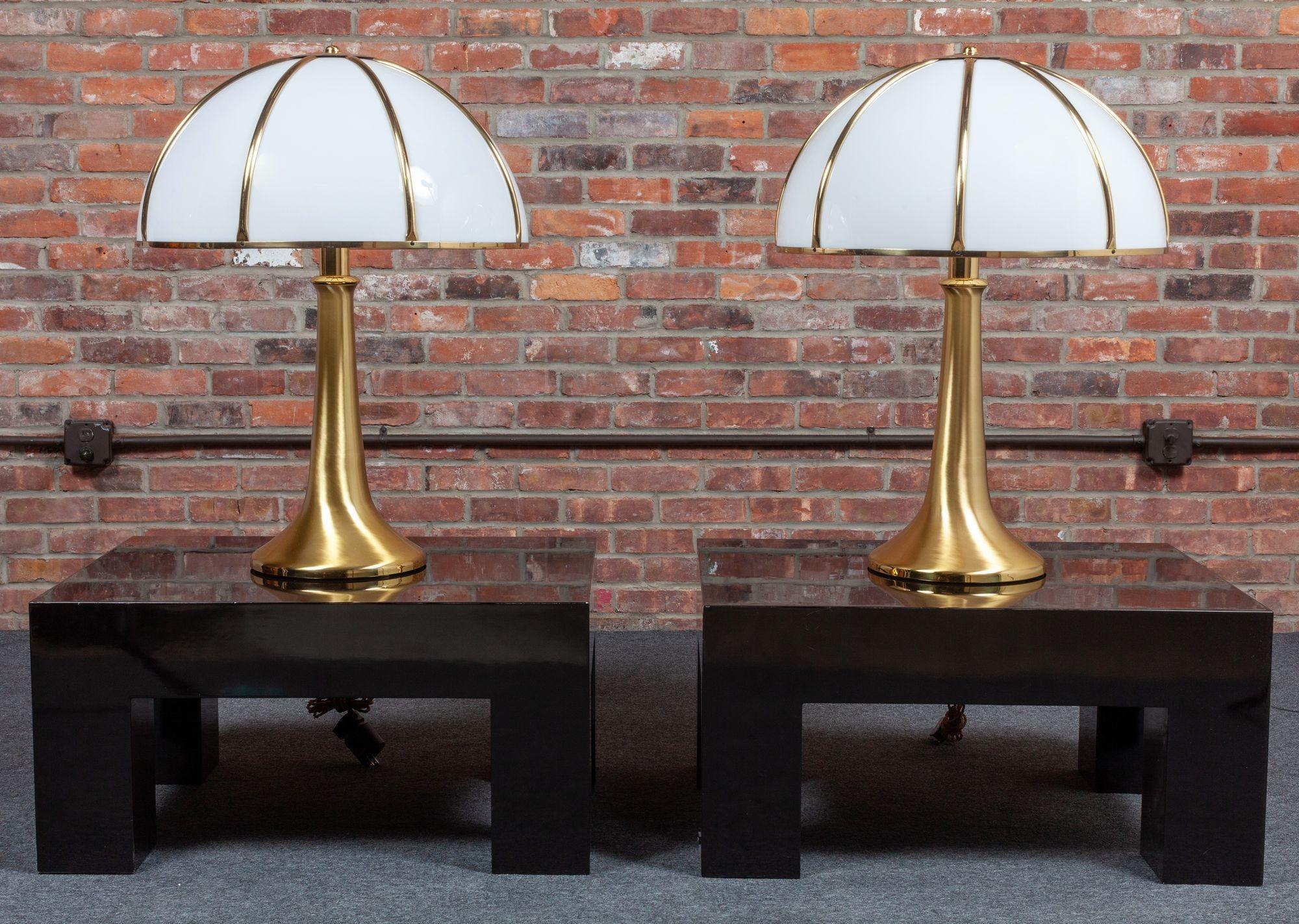 Monumental pair of Gabriella Crespi “Fungo” table lamps in brushed brass and white acrylic (ca. 1970, Italy).
Among the larger examples Crespi designed composed of oversized brass and white acrylic dome shades atop brushed brass trumpet bases with