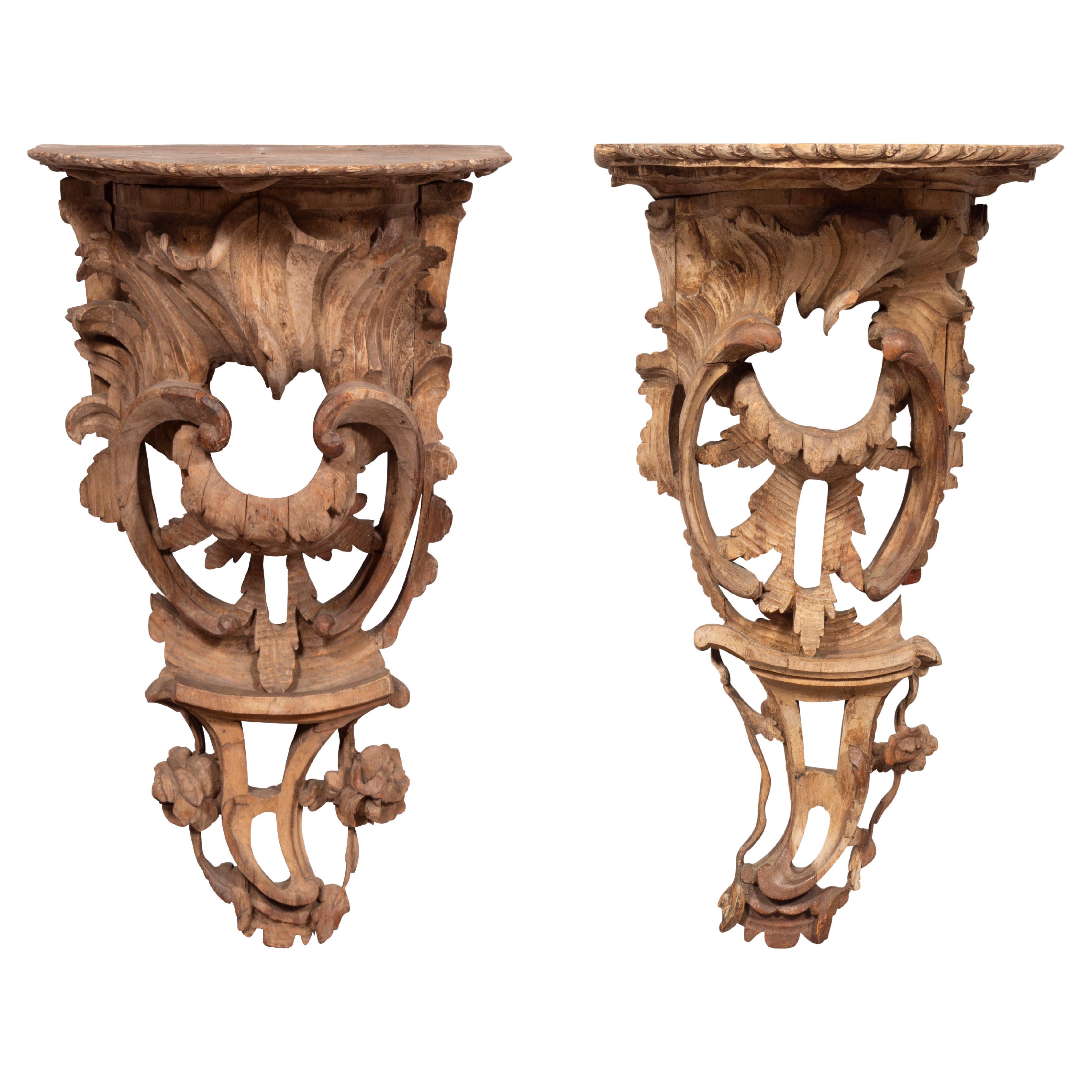 Originally gilded or painted. With a gadrooned edge to the demilune shaped shelf, the bracket with a rocaille carved shell and pierced scroll and flower head carving. From a Newport RI estate.