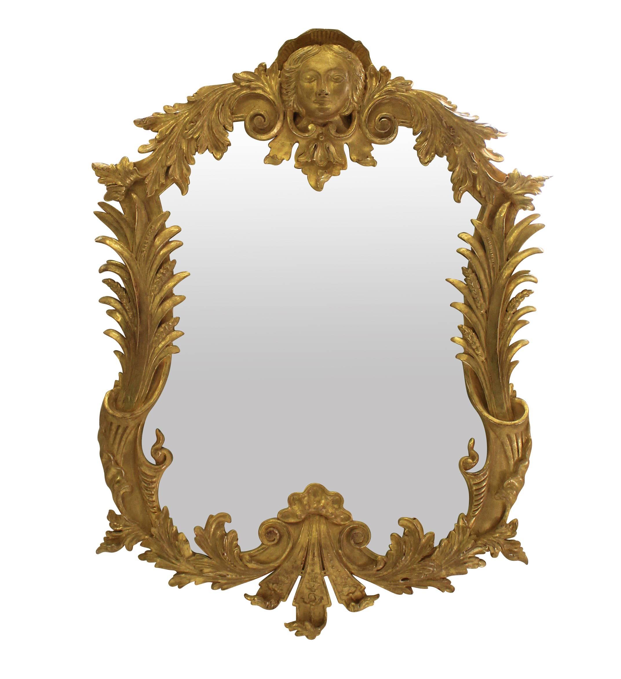 A pair of large carved and water gilded George III style classically inspired mirrors.
  