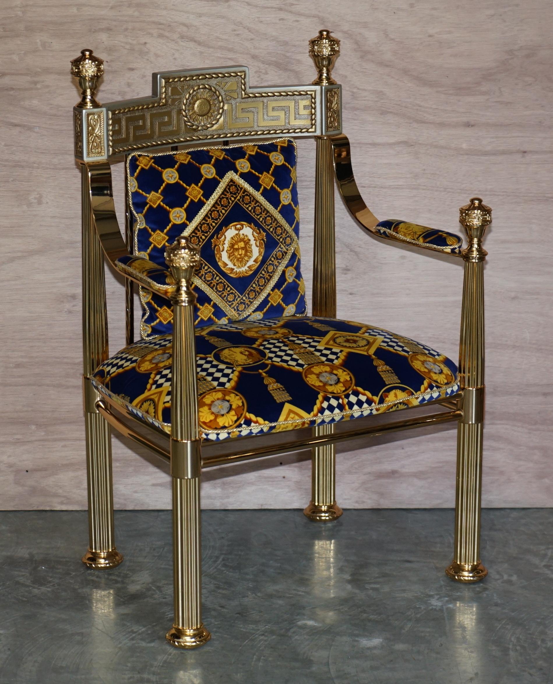 We are delighted to offer his exquisite pair of New Old Stock Gianni Versace Hollywood Regency throne armchairs

These chairs are very rare, new old stock upholstered with deep blue and gold velvet embroidered fabric depicting the Versace Lion’s